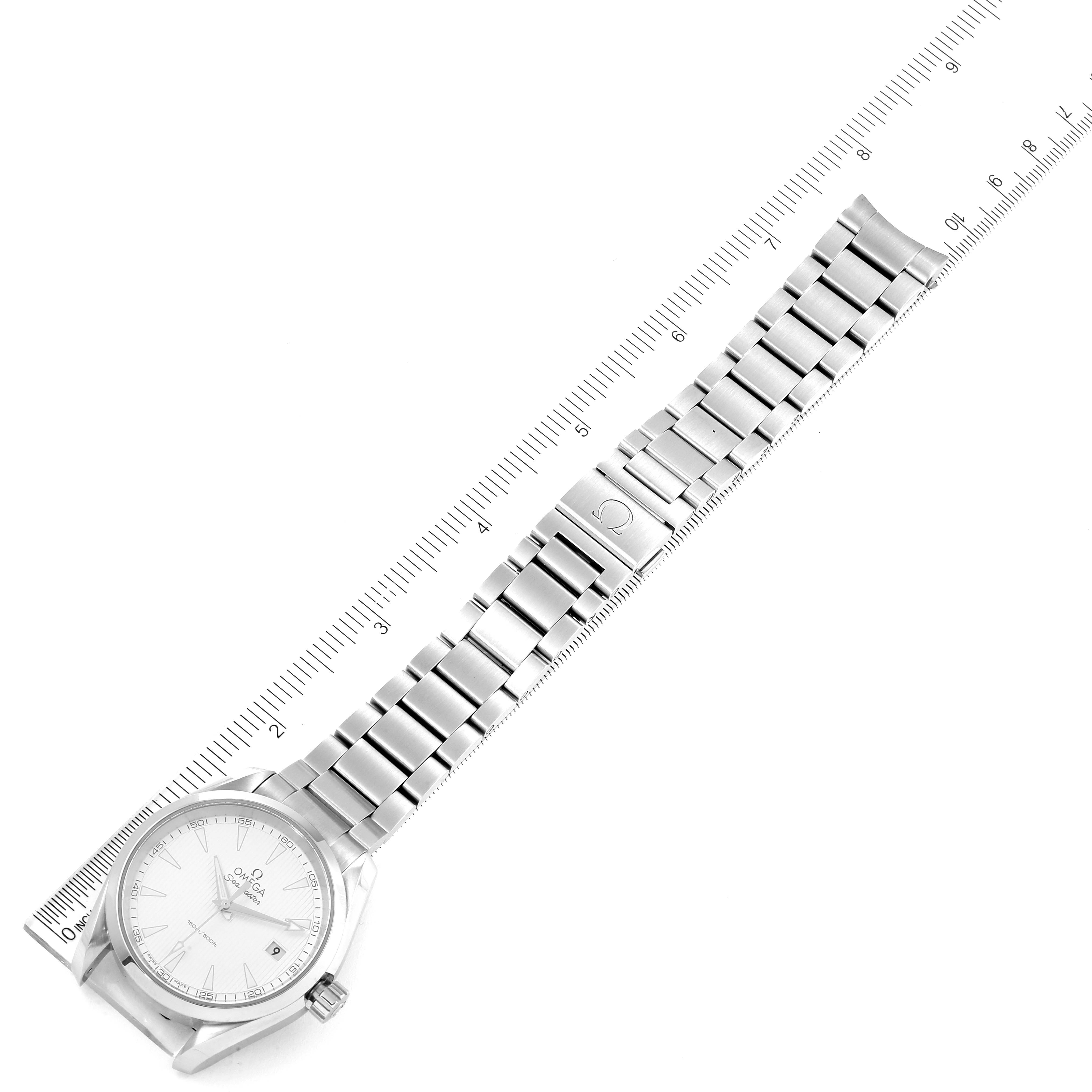 The image shows a top view of an Omega Aqua Terra 231.10.39.60.02.001 Men
s Stainless Steel Silver Dial 231.10.39.60.02.001 Men
s Stainless Steel Silver Dial watch with its entire bracelet and a measurement ruler alongside.
