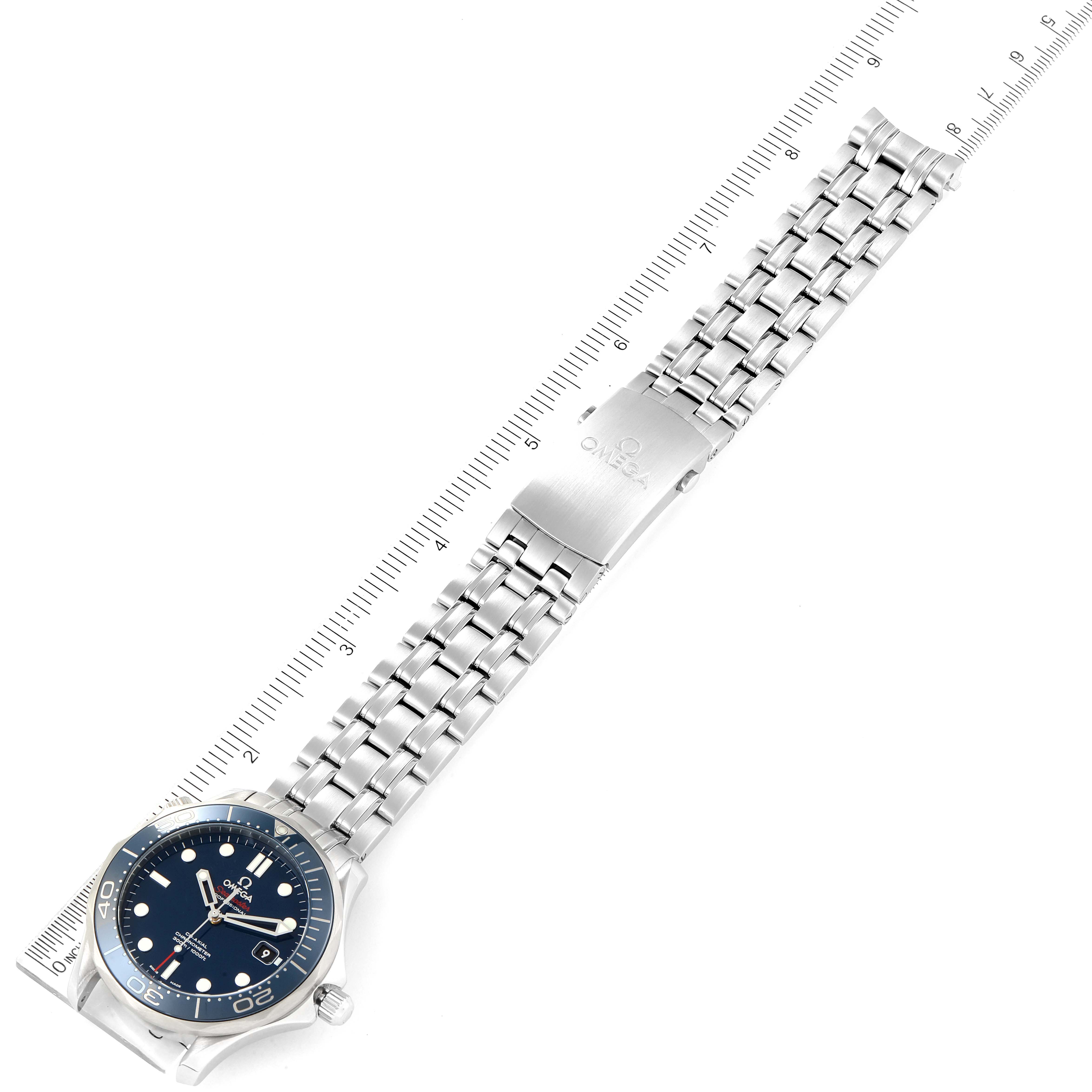 This image shows the Omega Seamaster 212.30.41.20.03.001 Men's Stainless Steel Blue Dial 212.30.41.20.03.001 Men's Stainless Steel Blue Dial watch laid flat, displaying the face, bezel, bracelet, and clasp, along with a ruler for scale.