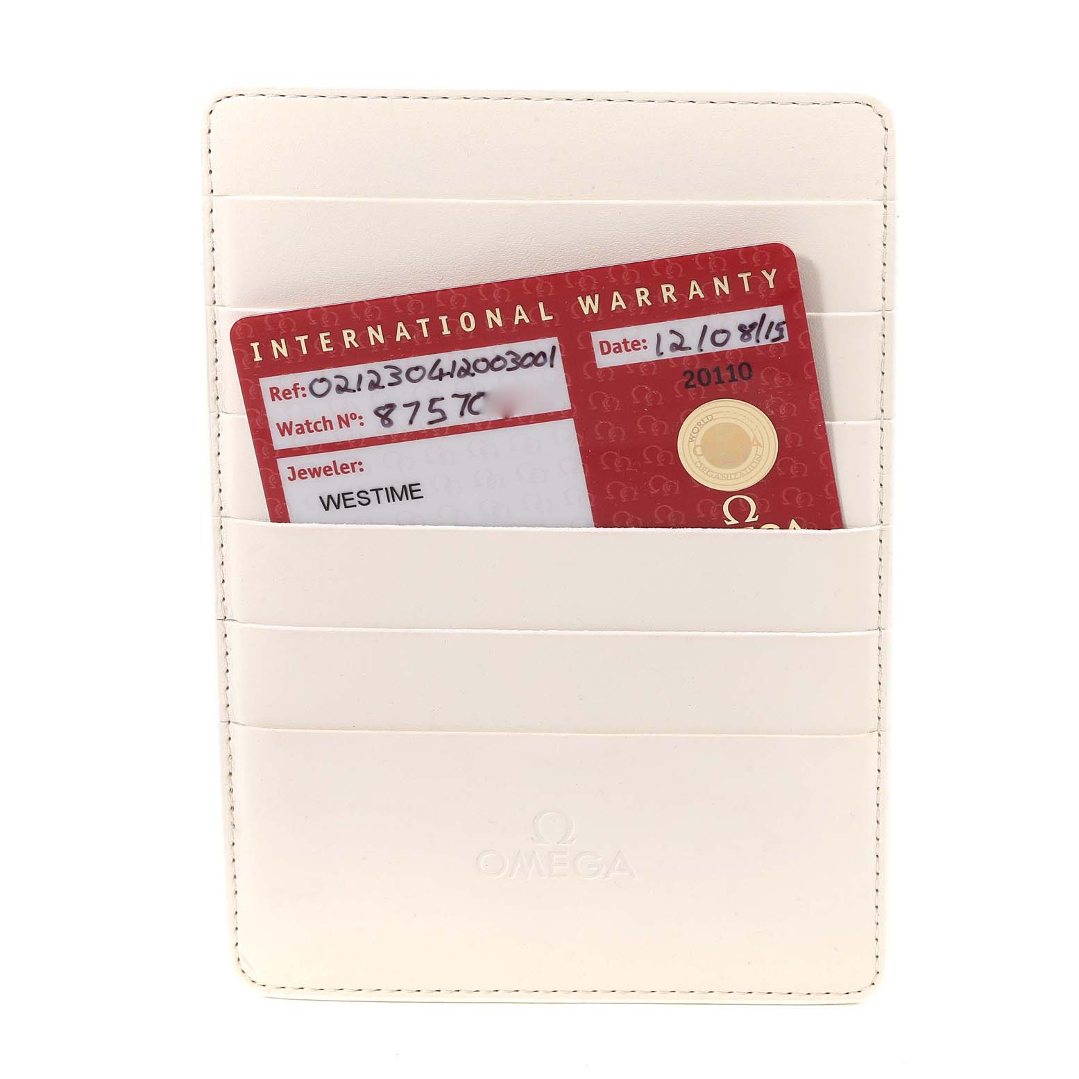 The image shows a white leather Omega cardholder with an International Warranty card for the Seamaster model.