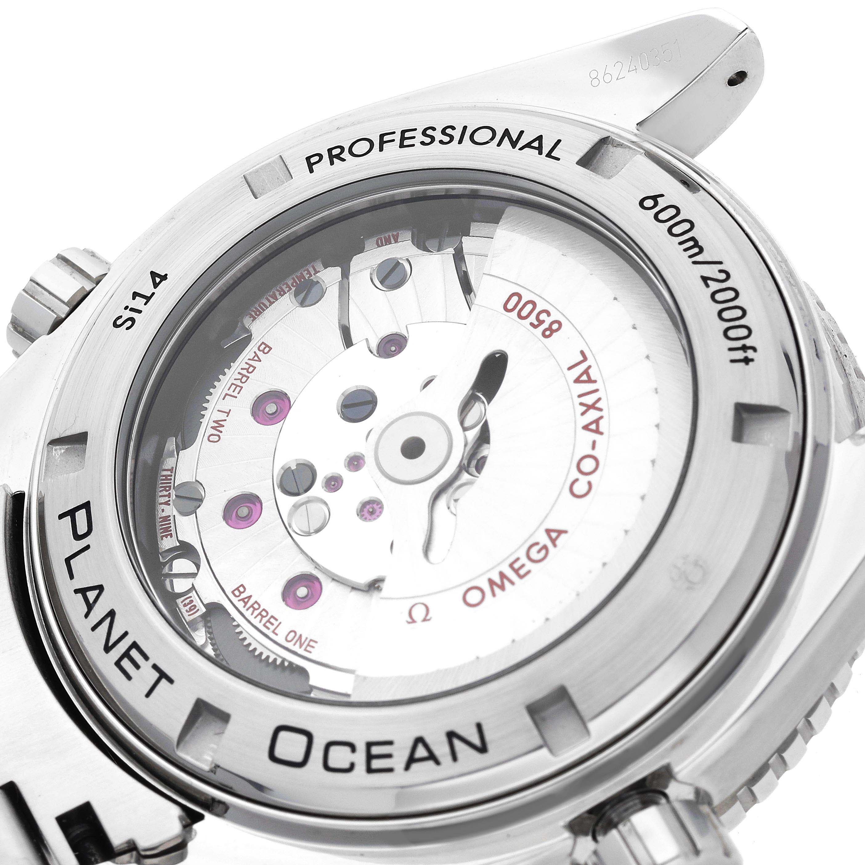 The image shows the caseback of an Omega Speedmaster 232.30.46.21.01.002 Men's Stainless Steel Black Dial 232.30.46.21.01.002 Men's Stainless Steel Black Dial, revealing its co-axial movement.