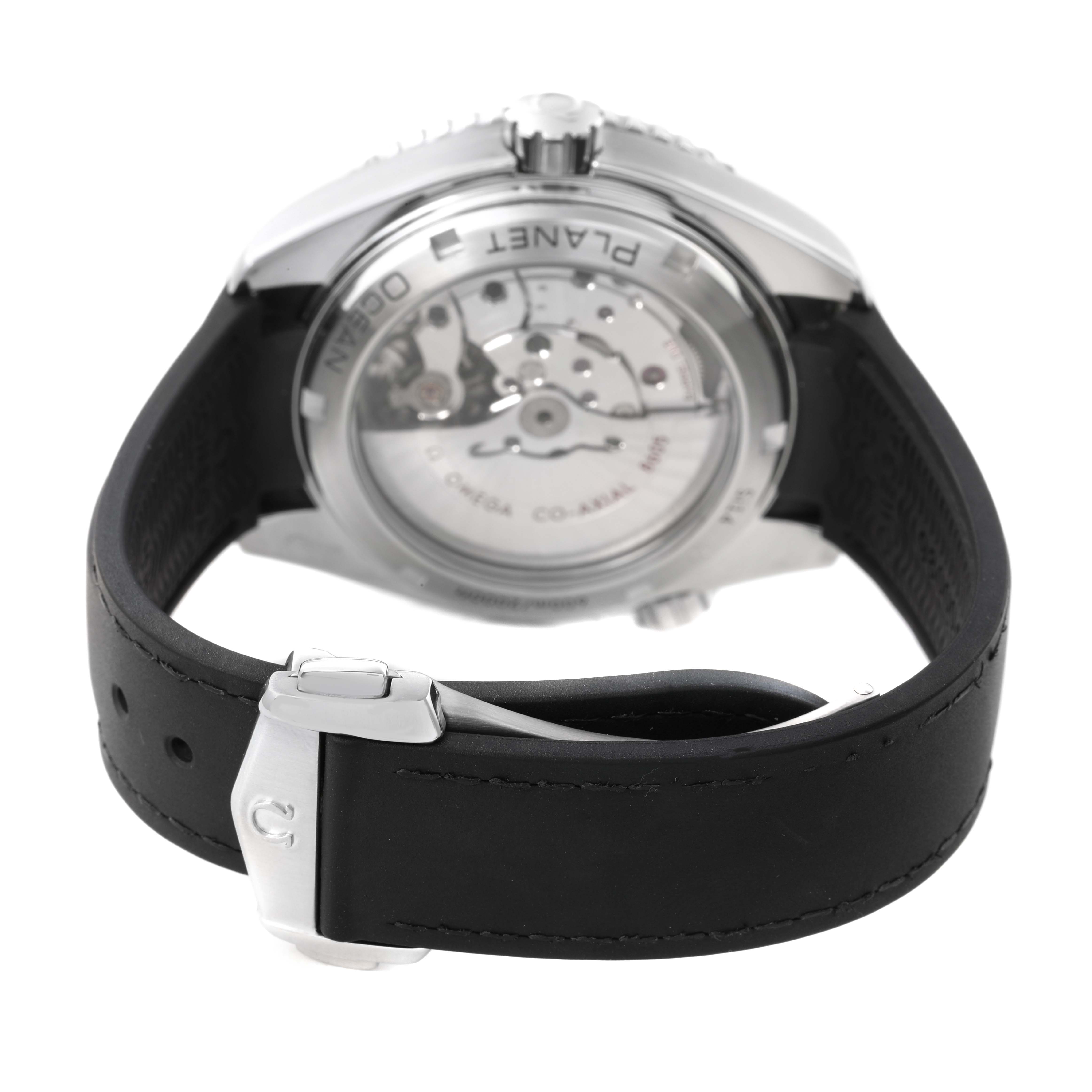 The image shows the back view of the Omega Planet Ocean 232.32.44.22.01.001 Men's Stainless Steel Black Dial watch, displaying its transparent case back and black strap with clasp.