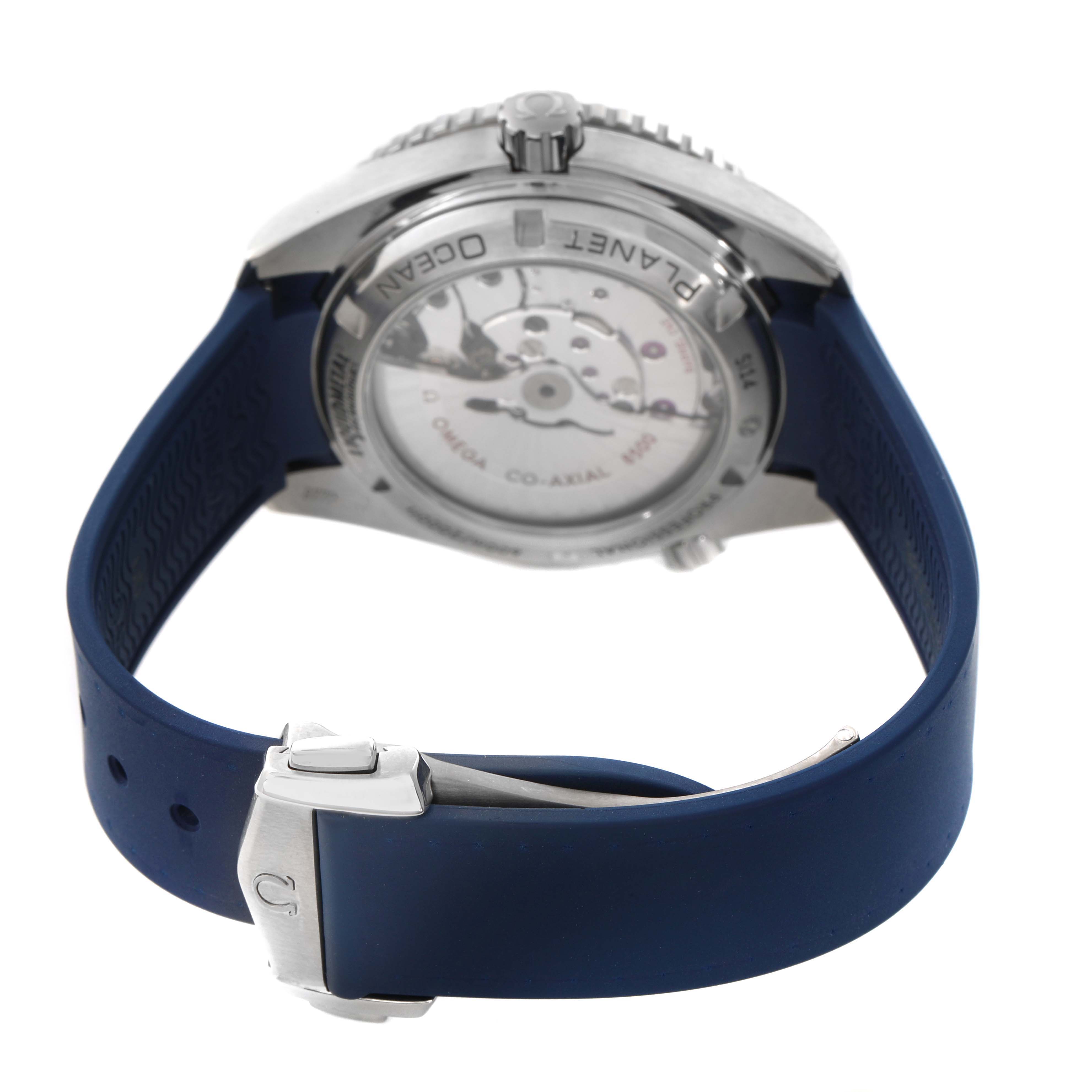 The image shows the back of the Omega Seamaster 232.92.42.21.03.001 Men's Titanium Blue Dial with a view of the transparent case back and part of the blue strap clasp.