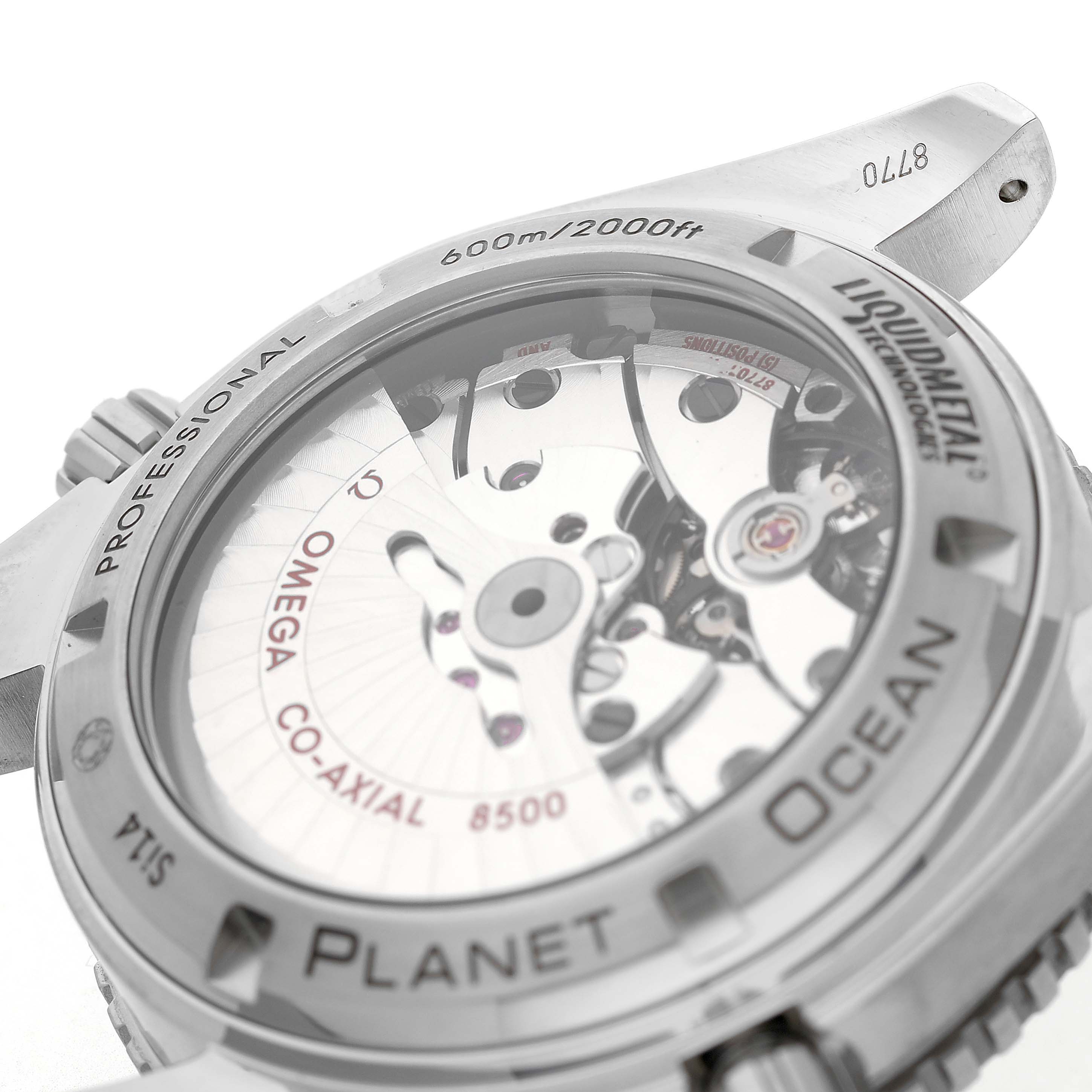 The image shows an angled view of the Omega Seamaster 232.92.42.21.03.001 Men's Titanium Blue Dial's back, revealing the movement and case details like "Planet Ocean."