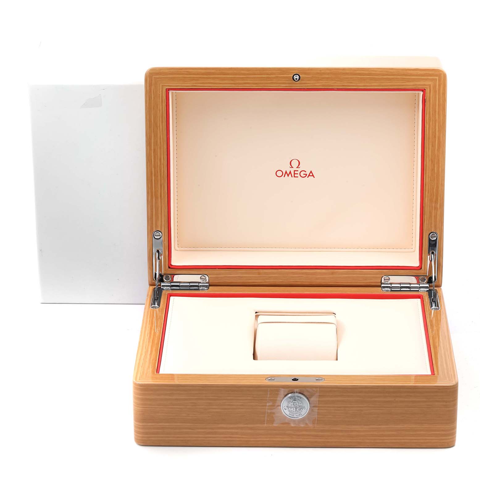 This image shows an open wooden Omega Speedmaster 311.30.42.30.03.001 Men's Stainless Steel Blue Dial 311.30.42.30.03.001 Men's Stainless Steel Blue Dial watch box with a beige interior and red accents.