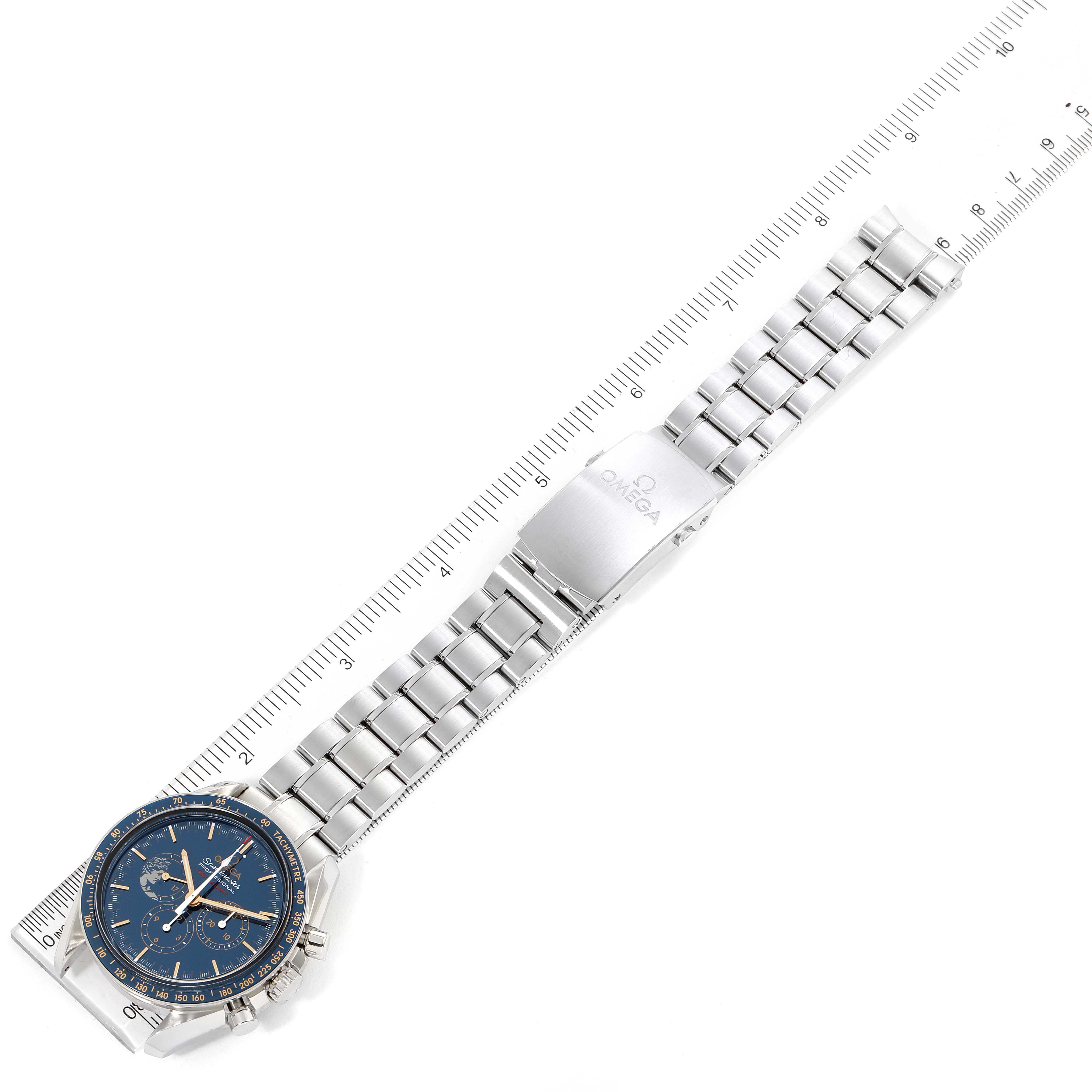 The Omega Speedmaster 311.30.42.30.03.001 Men's Stainless Steel Blue Dial 311.30.42.30.03.001 Men's Stainless Steel Blue Dial watch is displayed flat with its face, metal bracelet, and clasp visible, positioned along a ruler.