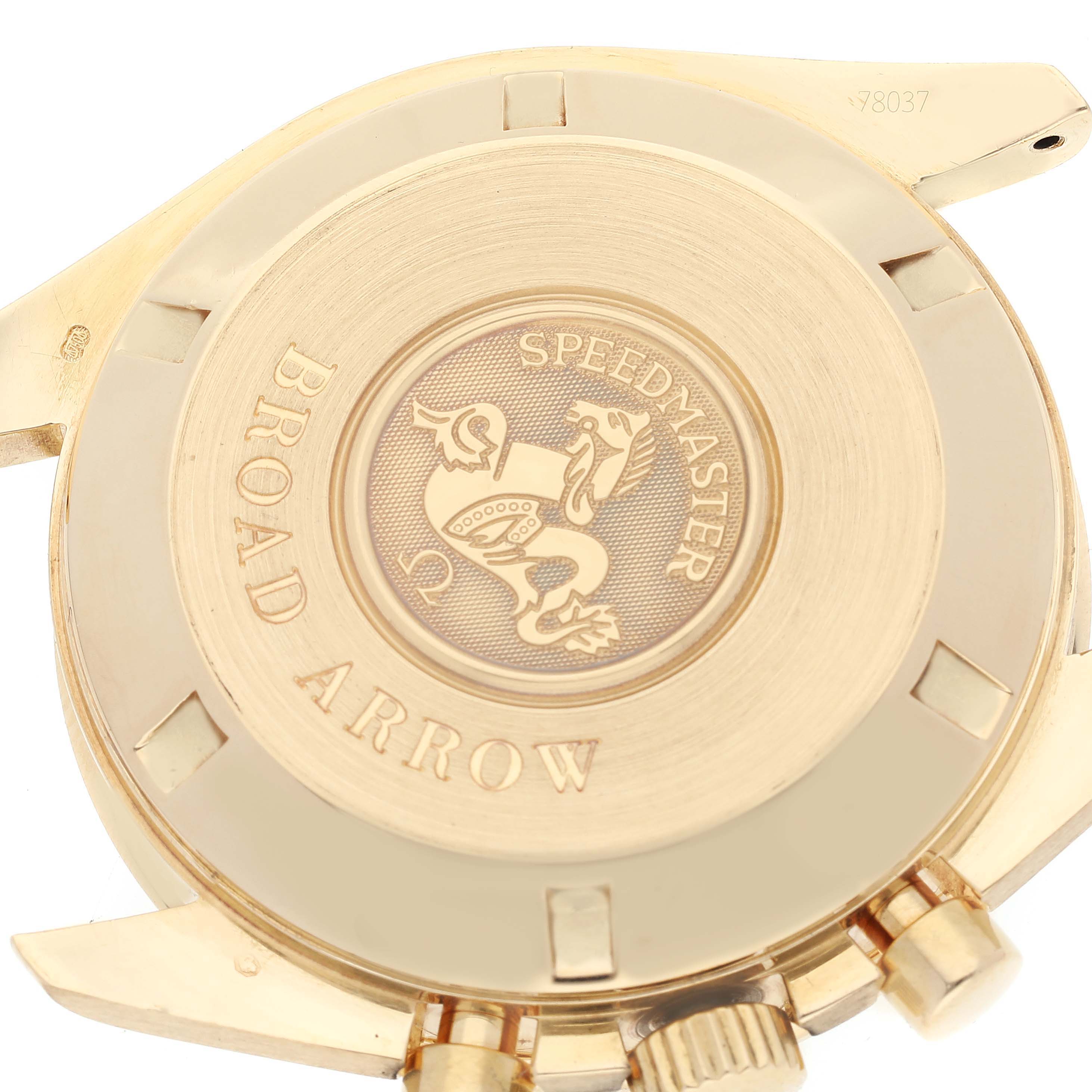 The image displays the case back of an Omega Speedmaster 3651.50.31 Men's Yellow Gold Black Dial 3651.50.31 Men's Yellow Gold Black Dial Broad Arrow watch, highlighting its engravings and design details.