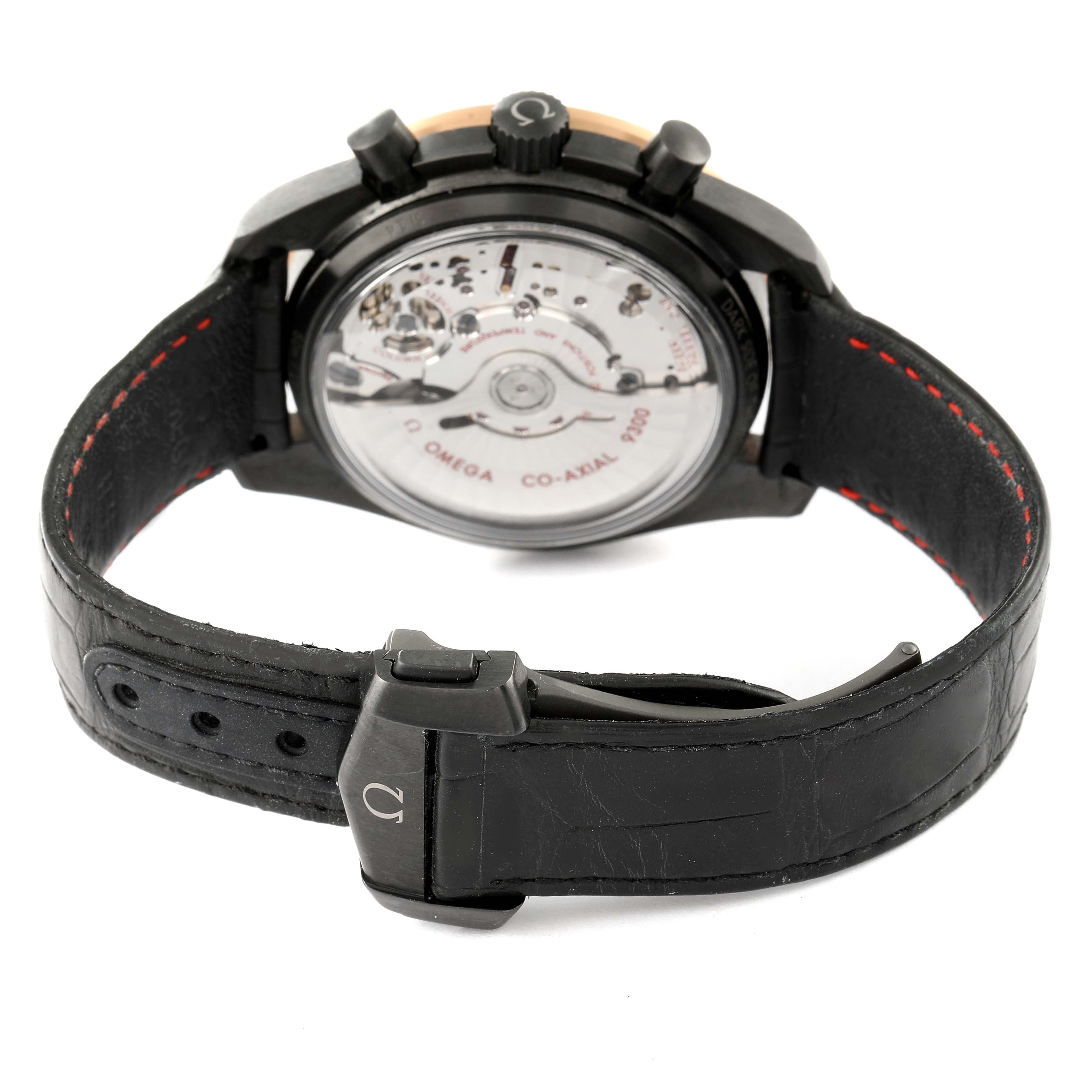 The image shows the back view of the Omega Speedmaster 311.63.44.51.06.001 Men's Ceramic Grey Dial 311.63.44.51.06.001 Men's Ceramic Grey Dial watch, showcasing the movement and the leather strap with a buckle.