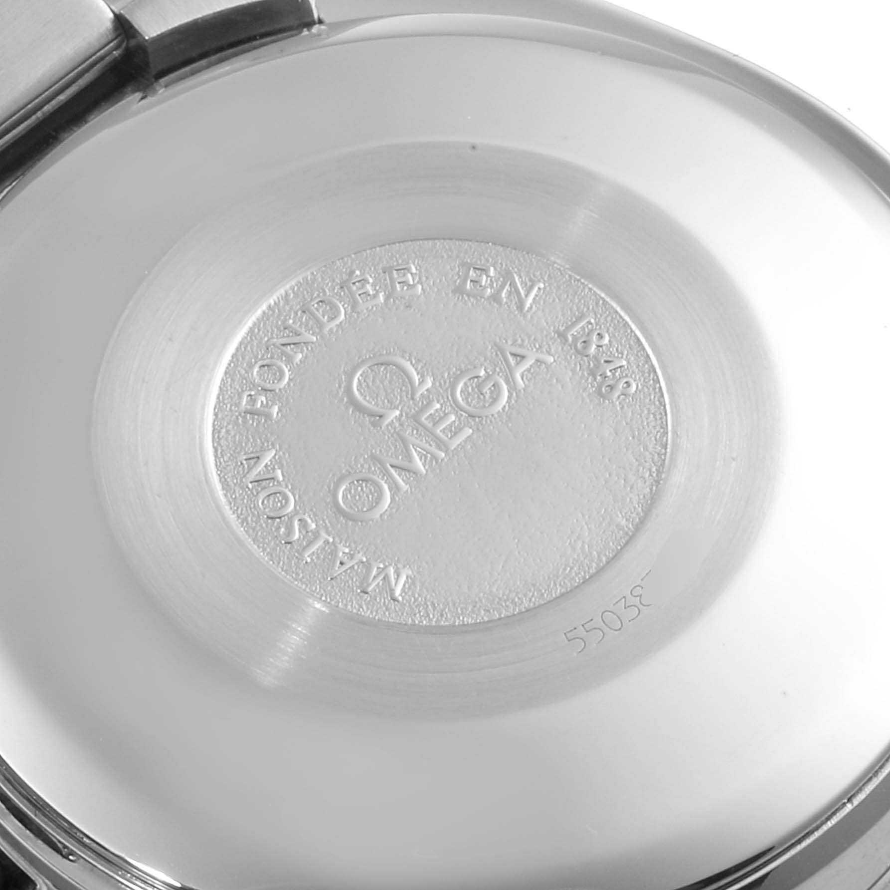 This image shows the back case of an Omega Speedmaster 3521.80.00 Men
s Stainless Steel Blue Dial 3521.80.00 Men
s Stainless Steel Blue Dial watch, displaying the brand
s logo and inscription.