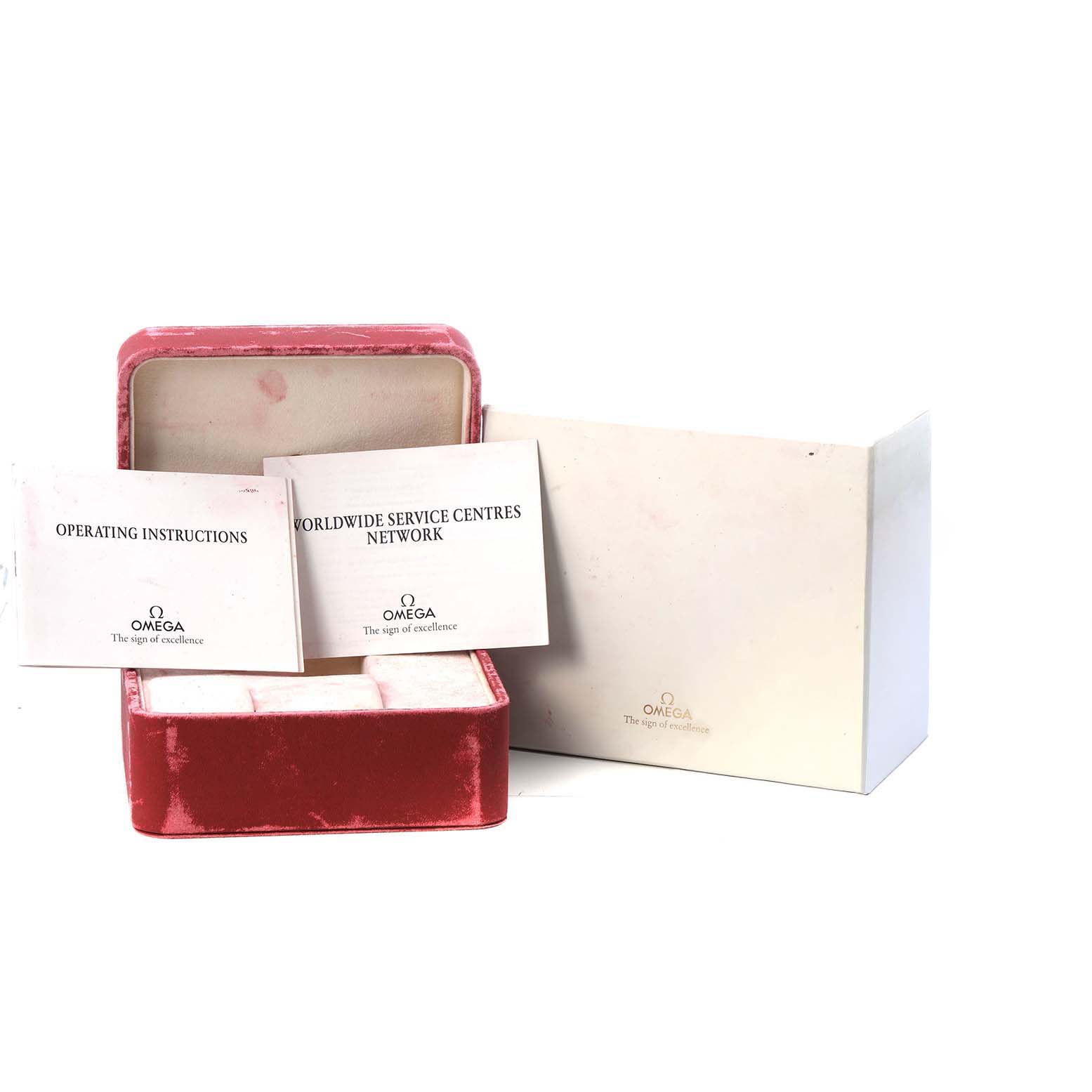 The image shows a red Omega Speedmaster 3513.53.00 Men's Stainless Steel Black Dial watch box with operating instructions and a service centers booklet.