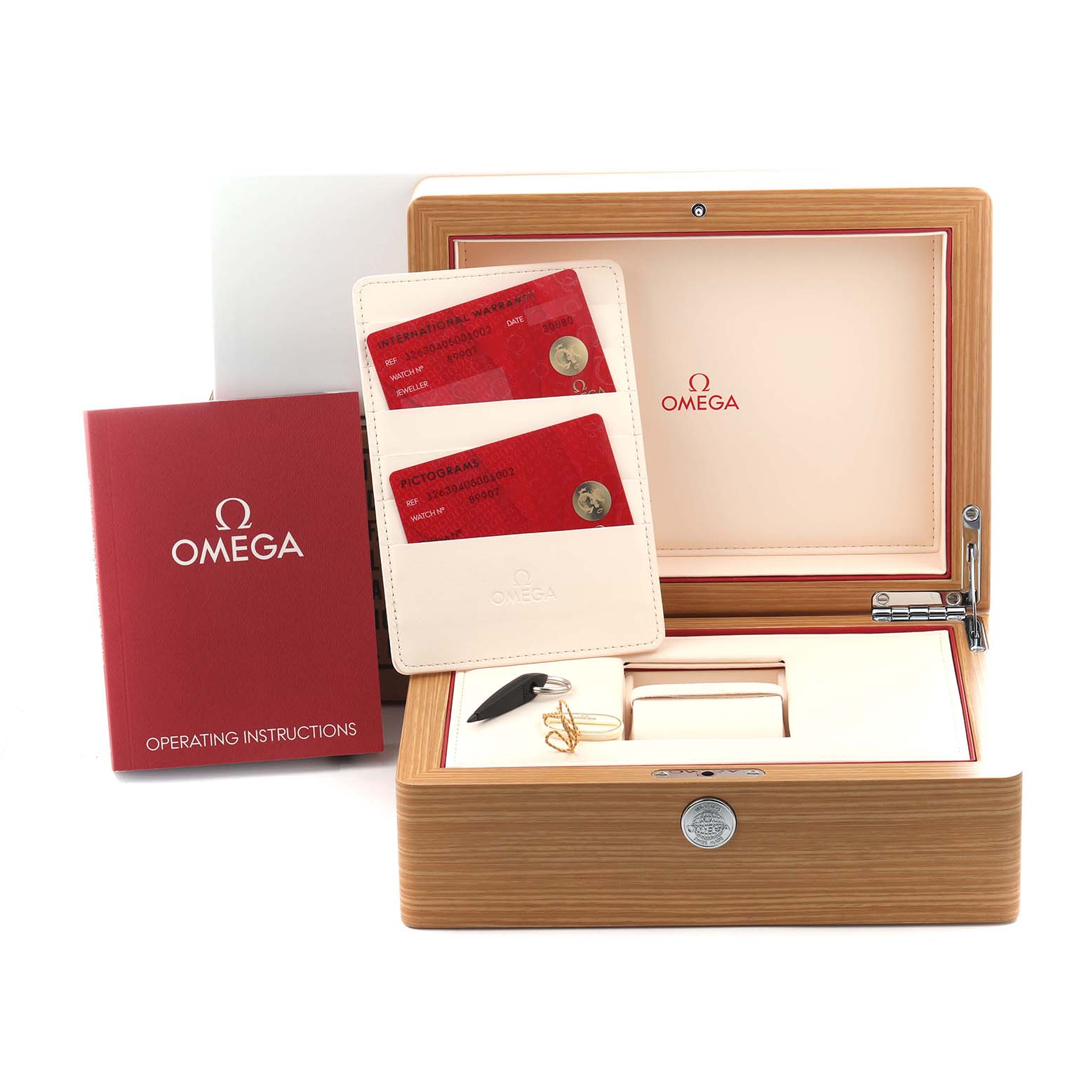 The image shows the Omega Speedmaster 326.30.40.50.01.002 Men's Stainless Steel Black Dial 326.30.40.50.01.002 Men's Stainless Steel Black Dial accessories, including a watch box, instruction manual, warranty cards, and tools.