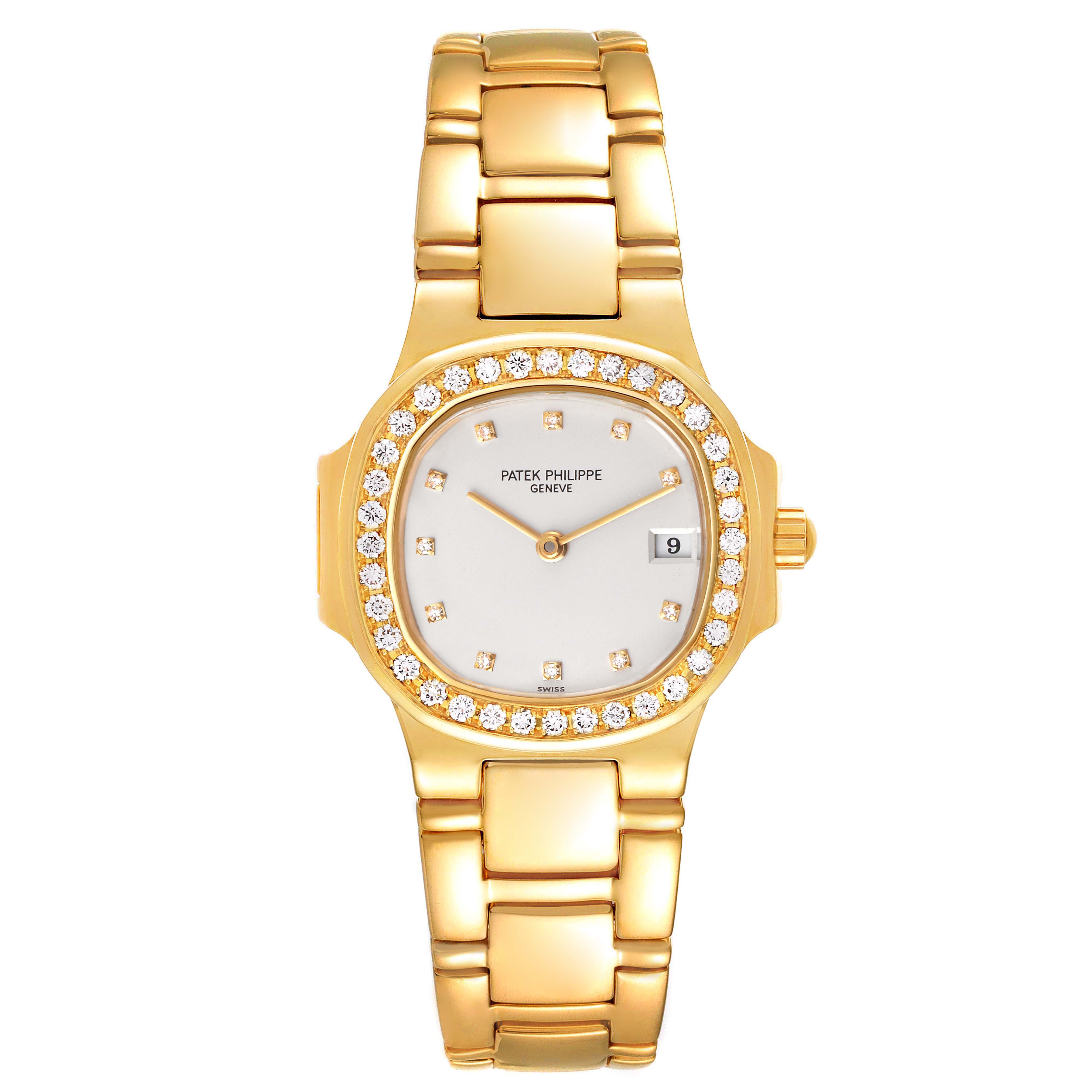 The image shows a frontal view of a Patek Philippe Nautilus 4700/530 Women's Yellow Gold Beige Dial 4700/530 Women's Yellow Gold Beige Dial watch, highlighting its gold case, bracelet, diamond bezel, and dial.