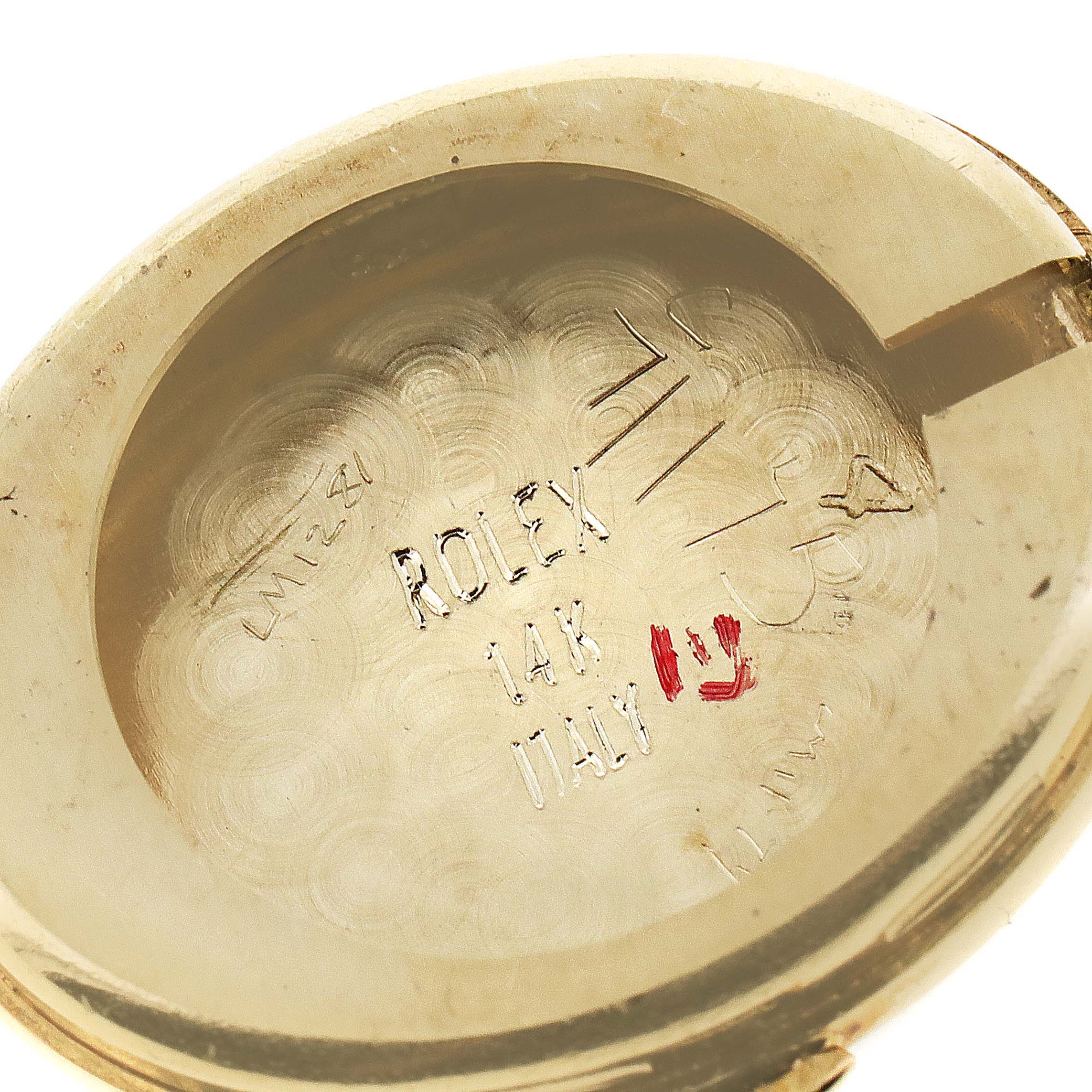 This is the interior case back of a Rolex Cocktail  Women's Yellow Gold Champagne Dial  Women's Yellow Gold Champagne Dial model watch, displaying "ROLEX," "14K," and "ITALY" engravings.