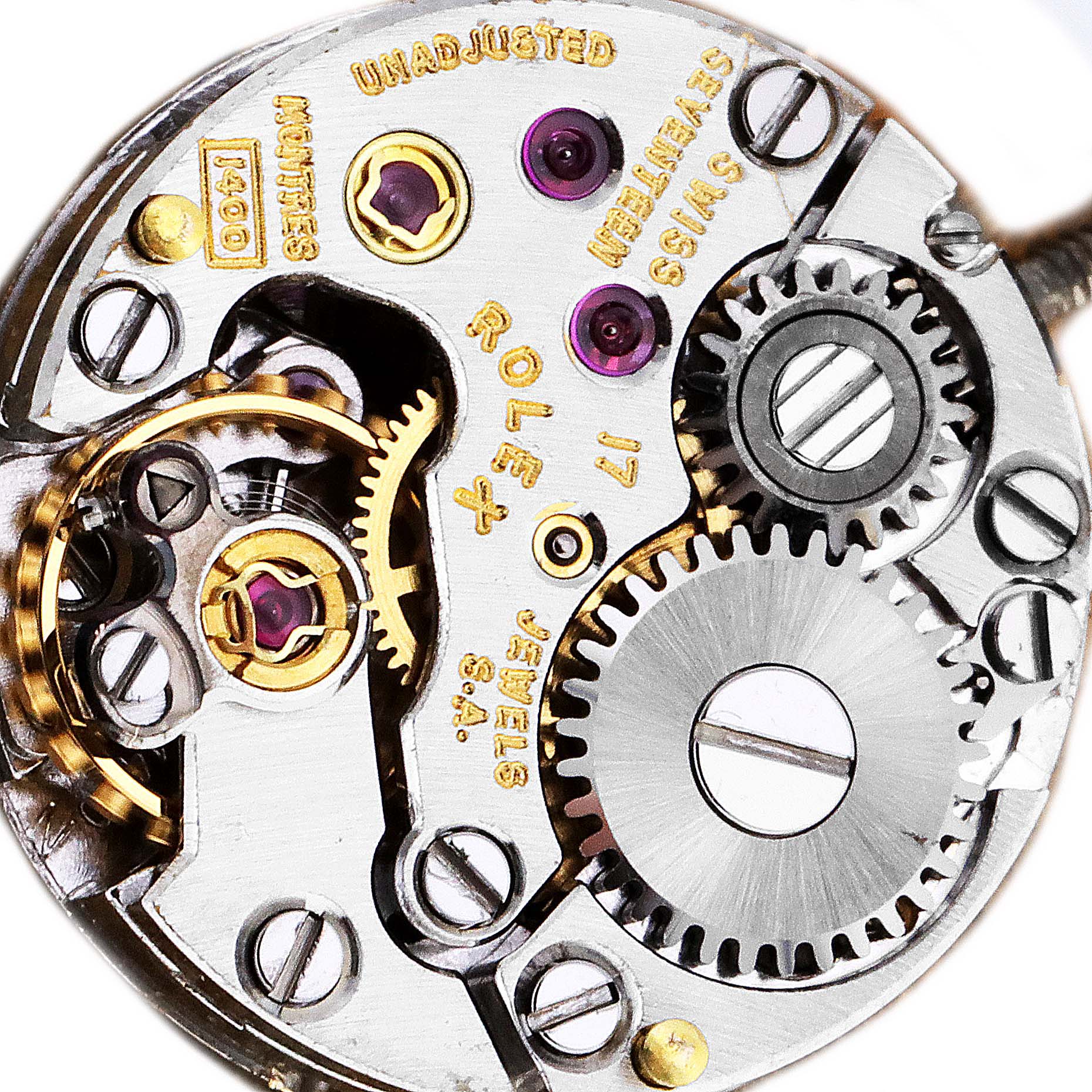 The image shows a close-up view of the mechanical movement inside the Rolex Cocktail  Women's Yellow Gold Champagne Dial  Women's Yellow Gold Champagne Dial watch, highlighting its gears and components.