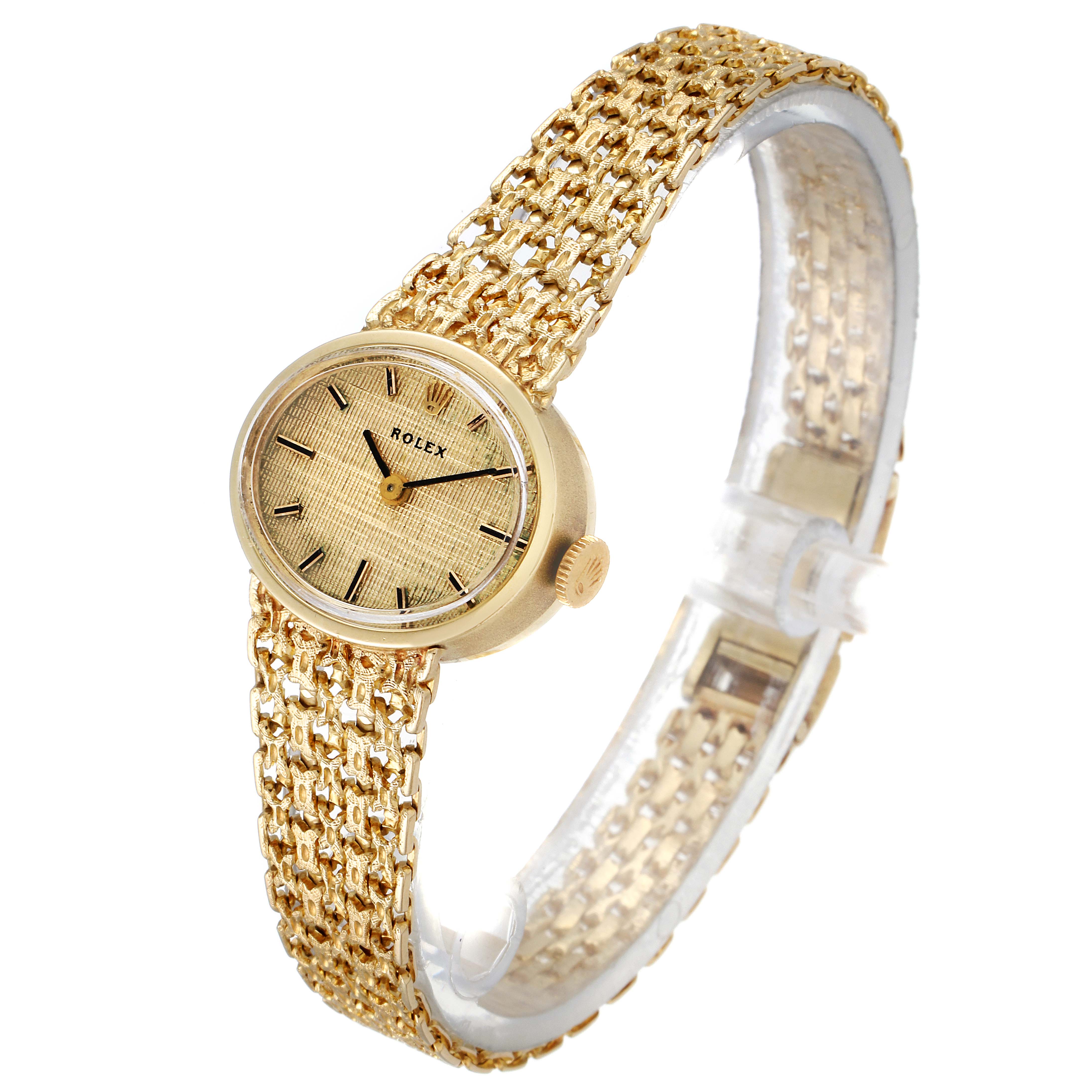 The Rolex Cocktail  Women's Yellow Gold Champagne Dial  Women's Yellow Gold Champagne Dial model watch is shown from a front-left angle, displaying the face, crown, and bracelet in gold.
