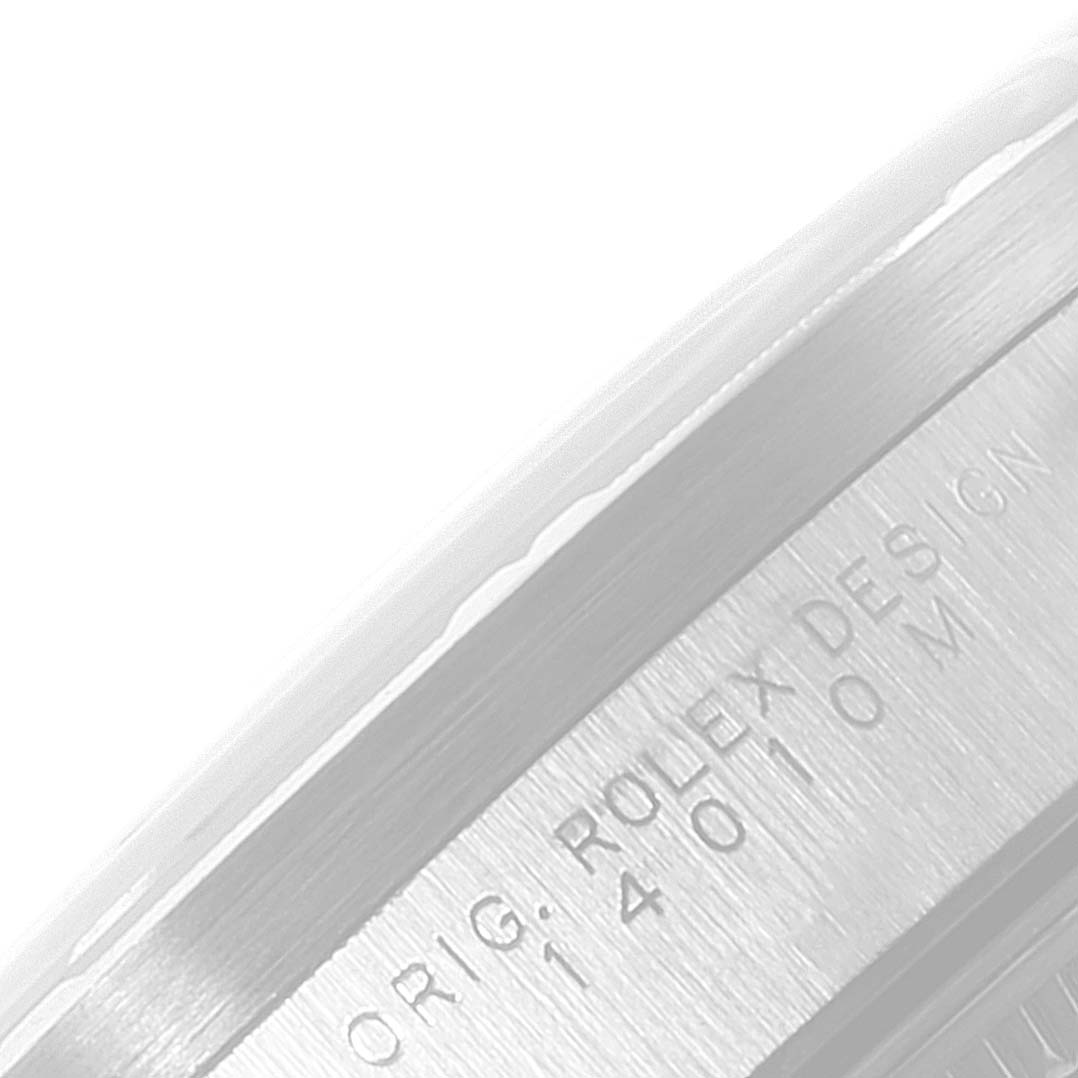 This image shows a close-up of the case side on a Rolex Air-King 14010 Men's Stainless Steel Silver Dial 14010 Men's Stainless Steel Silver Dial watch, highlighting the engraved text.