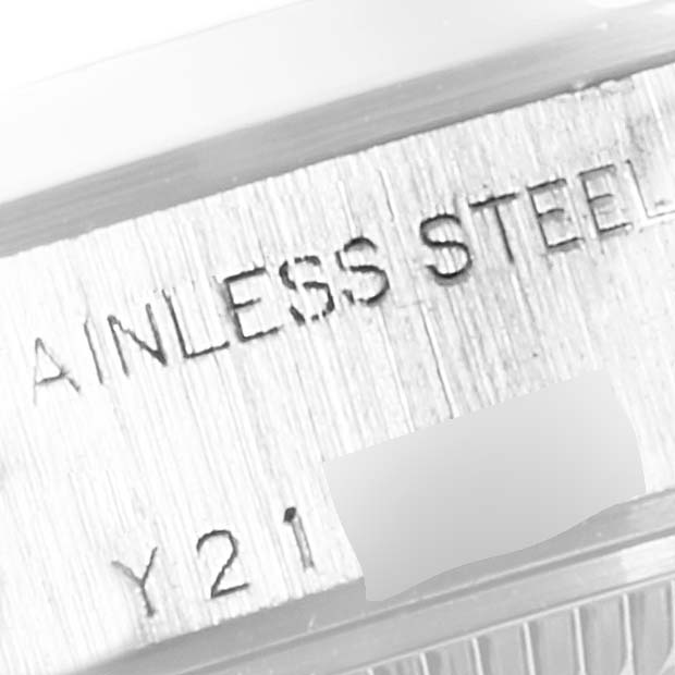 This image shows a close-up view of the stainless steel case marking on a Rolex Date 79160 Women's Stainless Steel White Dial 79160 Women's Stainless Steel White Dial model watch.