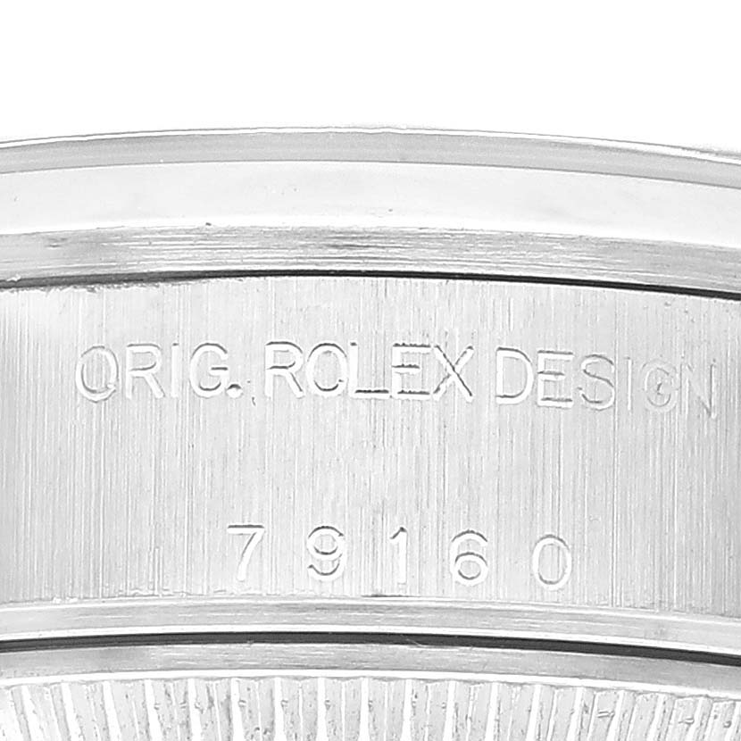 The image shows a close-up of the side case of a Rolex Datejust 79160 Women's Stainless Steel Black Dial 79160 Women's Stainless Steel Black Dial watch, displaying the engraving "ORIG. ROLEX DESIGN" with the model number "79160".