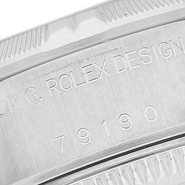 The image shows a close-up of the engraved case back of a Rolex Date 79190 Women's Stainless Steel White Dial watch, displaying the model number.
