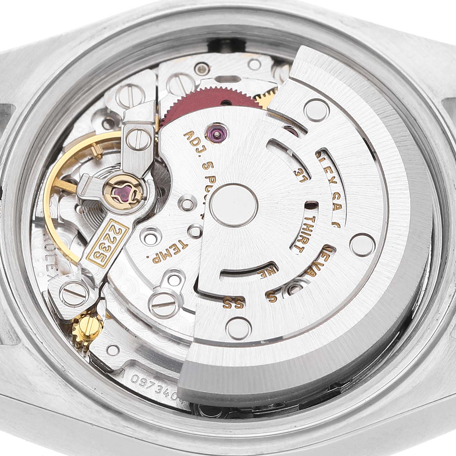 The image shows the movement of a Rolex Datejust 79174 Women's Stainless Steel Silver Dial watch from a back view, highlighting the rotor and intricate mechanical parts.