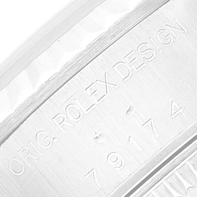 This is a close-up of the engravings on the inner bezel of a Rolex Datejust 79174 Women's Stainless Steel Silver Dial 79174 Women's Stainless Steel Silver Dial watch.