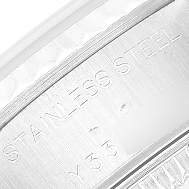This close-up image shows the engravings on the stainless steel caseback edge of the Rolex Datejust 79174 Women's Stainless Steel Silver Dial 79174 Women's Stainless Steel Silver Dial watch.