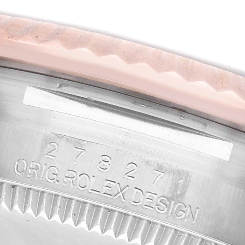 The image shows a close-up of the case side of a Rolex Mid-Size 278271 Women's Steel and Gold (two tone) Silver Dial 278271 Women's Steel and Gold (two tone) Silver Dial model, highlighting the engraved serial number and "Rolex Design."