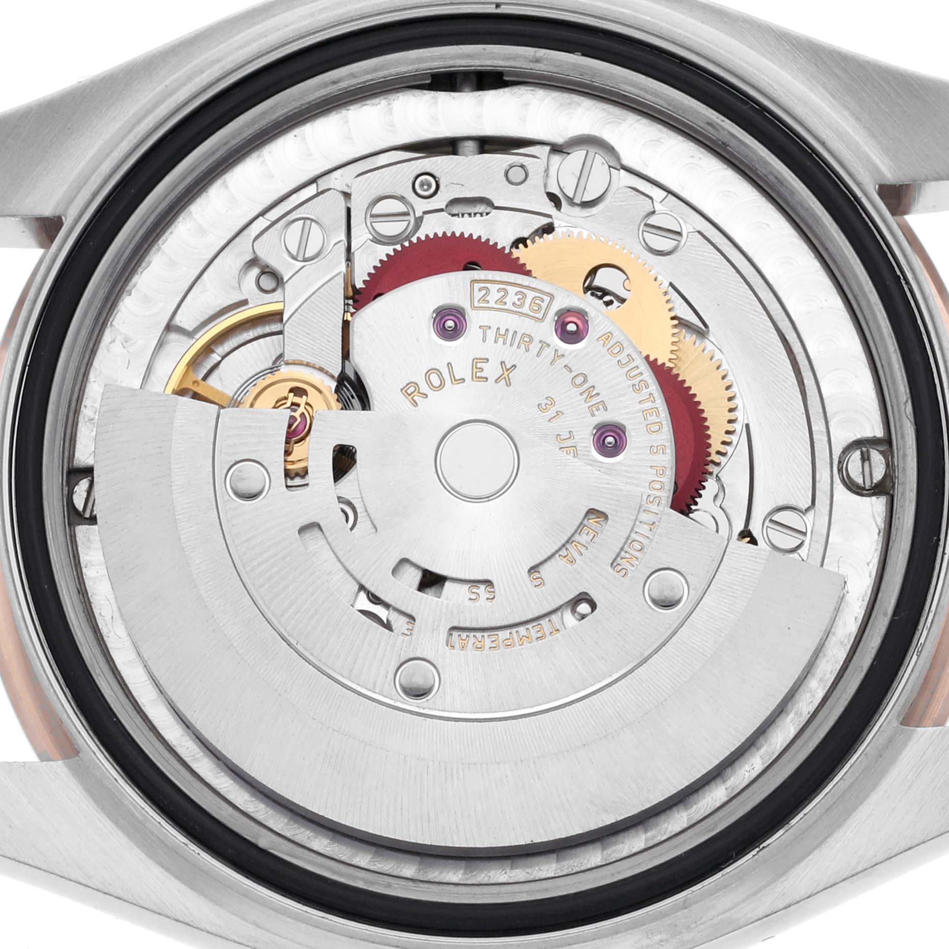 The image shows the movement of a Rolex Mid-Size 278271 Women's Steel and Gold (two tone) Silver Dial 278271 Women's Steel and Gold (two tone) Silver Dial watch from the back, highlighting its intricate inner components.