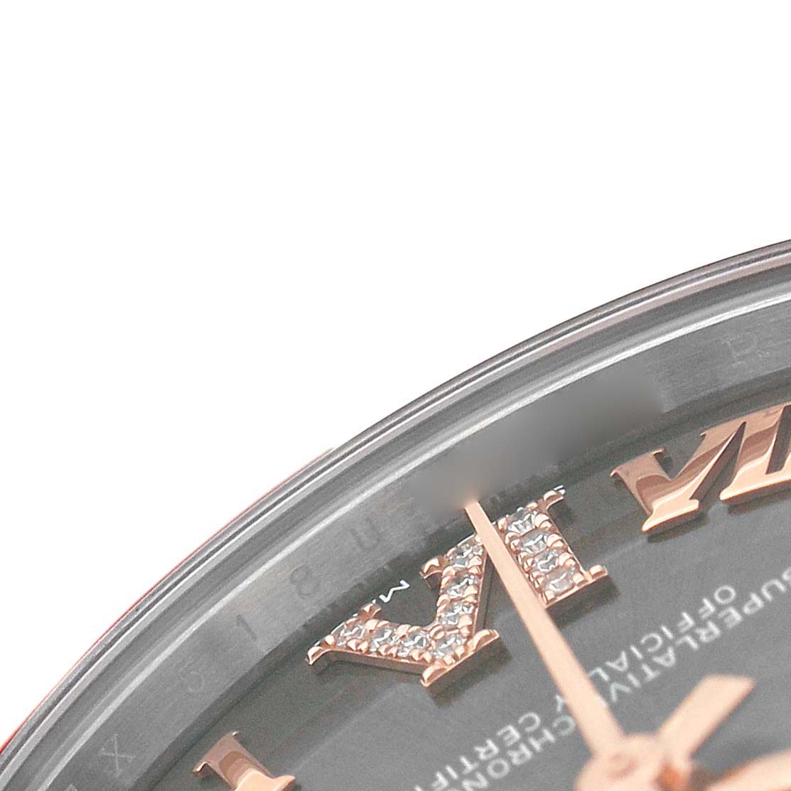 The image shows a close-up of the dial and bezel edge of a Rolex Mid-Size M278271-0029 Women's Steel and Gold (two tone) Grey Dial watch, highlighting the Roman numeral and hand.