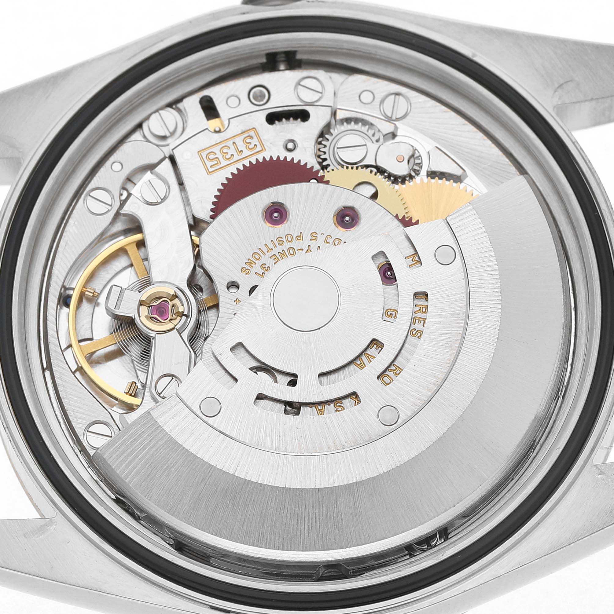 The image shows the movement of a Rolex Datejust 16233 Men's Steel and Gold (two tone) Champagne Dial from the back, highlighting its intricate components and rotor.
