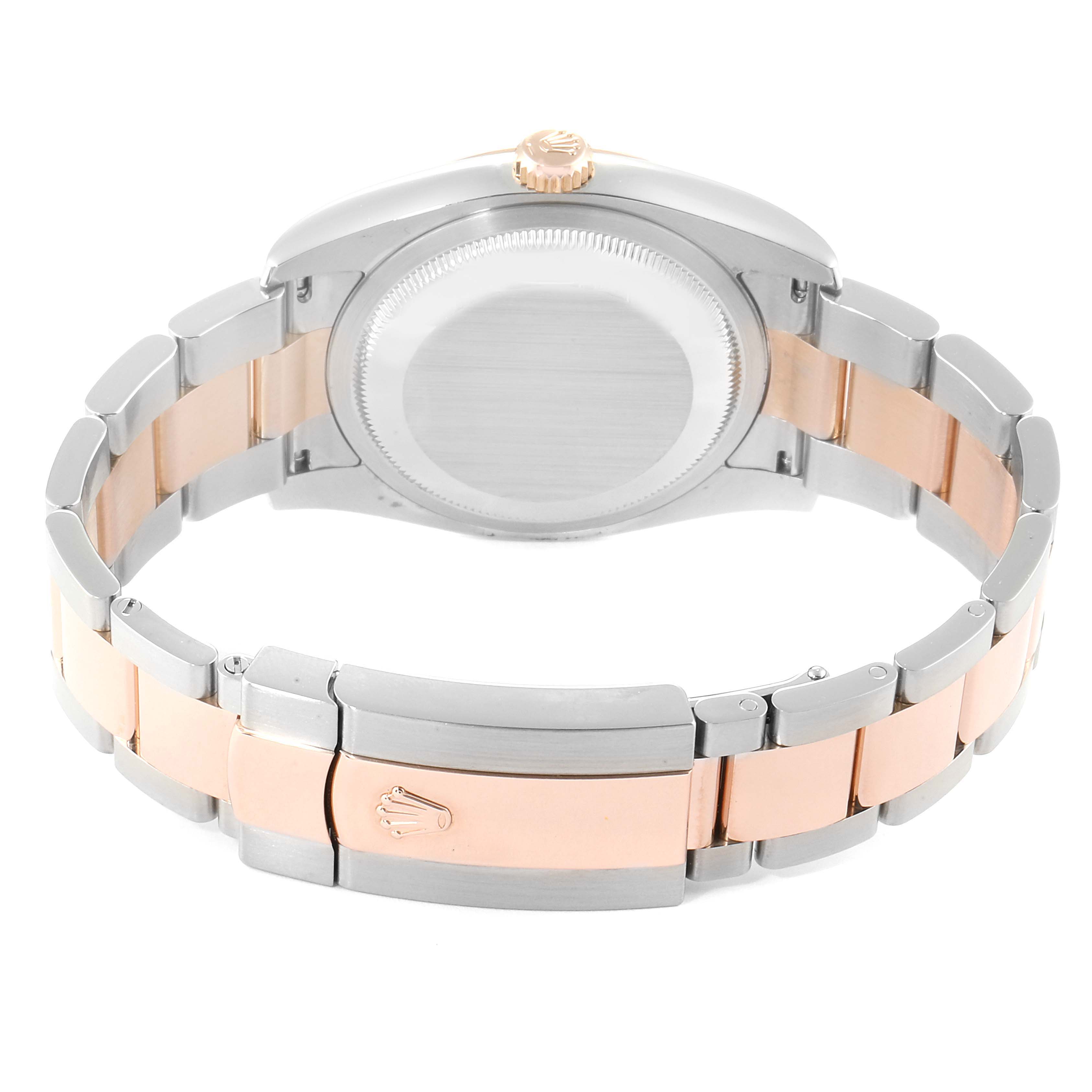 The image shows the back view of a Rolex Datejust 116231 Men
s Steel and Gold (two tone) Silver Dial 116231 Men
s Steel and Gold (two tone) Silver Dial watch, highlighting its case back and two-tone bracelet.