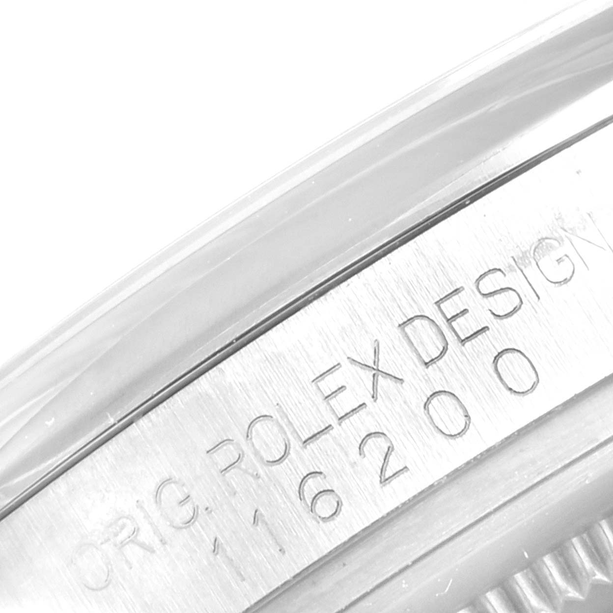 Close-up of the engraved case side on a Rolex Datejust 116200 Men's Stainless Steel Silver Dial 116200 Men's Stainless Steel Silver Dial model, showing "ORIG. ROLEX DESIGN 116200".