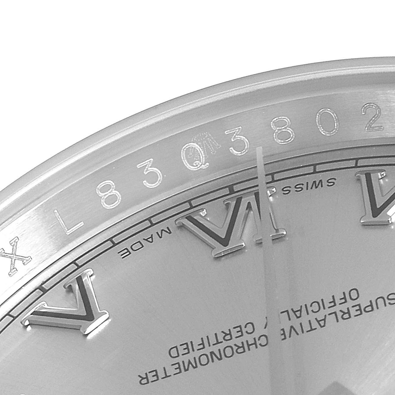 This image shows a close-up of the dial, Roman numerals, and some text of a Rolex Datejust 116200 Men's Stainless Steel Silver Dial 116200 Men's Stainless Steel Silver Dial watch.