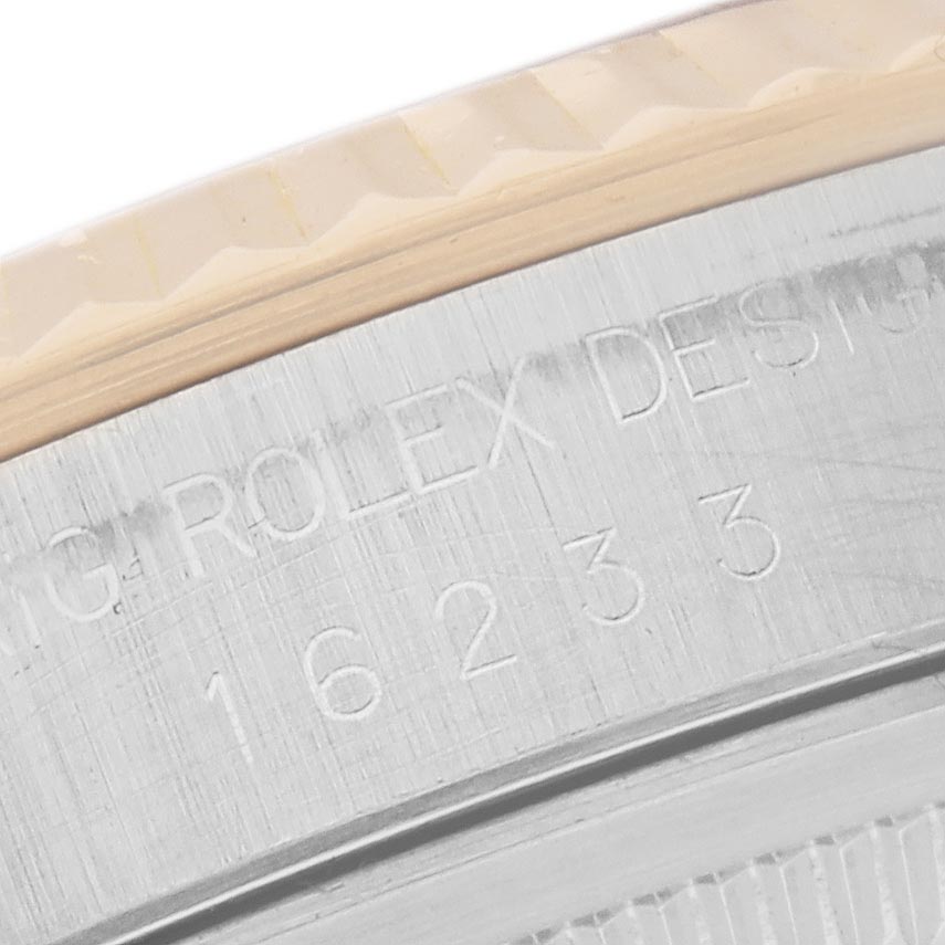The image shows a close-up of the engraved case back of a Rolex Datejust 16233 Men's Steel and Gold (two tone) Champagne Dial 16233 Men's Steel and Gold (two tone) Champagne Dial watch, focusing on model details.