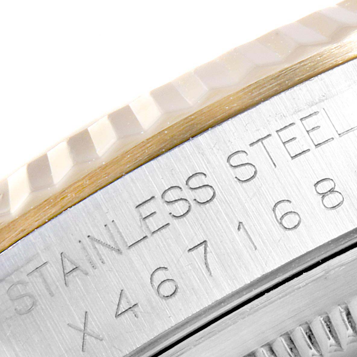 This close-up image shows the engraved stainless steel casing and part of the fluted bezel of a Rolex Datejust 16233 Men
s Steel and Gold (two tone) White Dial 16233 Men
s Steel and Gold (two tone) White Dial watch.