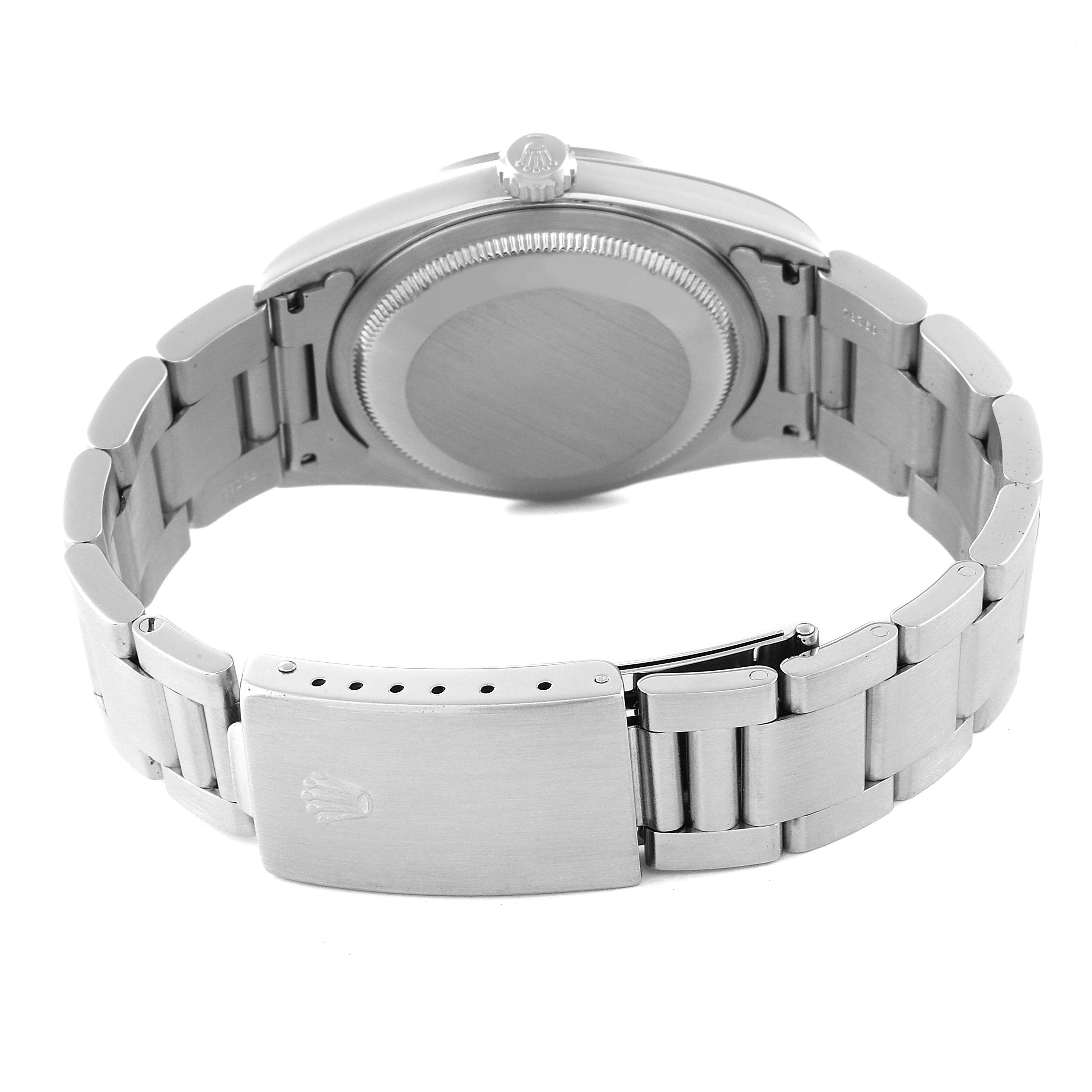 The image shows the back view of a Rolex Datejust 16200 Men's Stainless Steel Blue Dial 16200 Men's Stainless Steel Blue Dial watch, highlighting its case back, bracelet, and clasp.