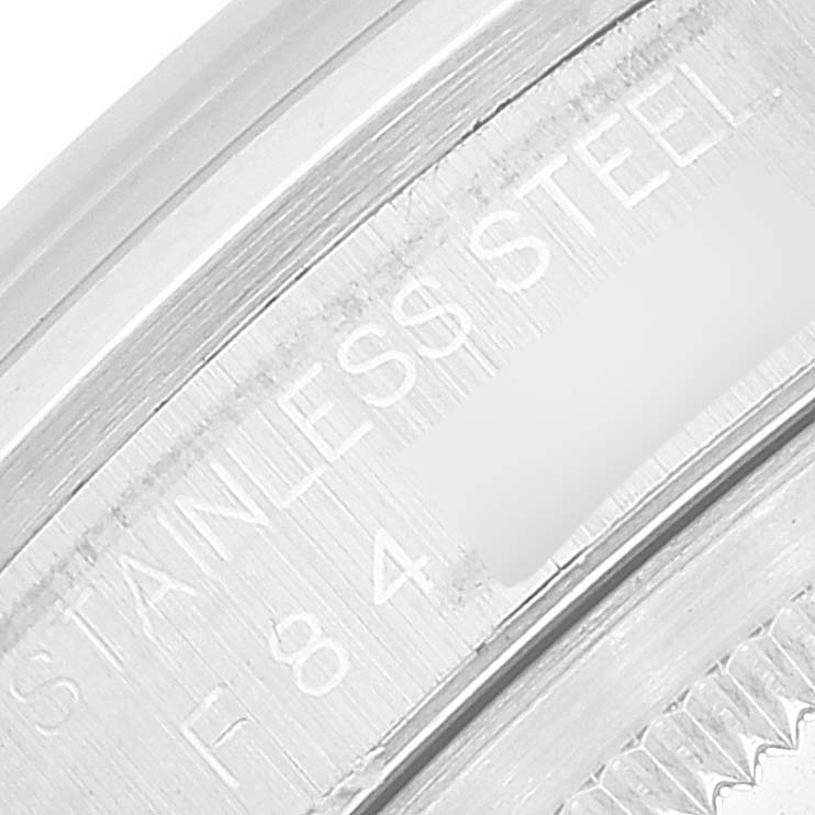 This image shows a close-up of the side engraving on the stainless steel case of a Rolex Datejust 16200 Men's Stainless Steel Blue Dial 16200 Men's Stainless Steel Blue Dial watch.