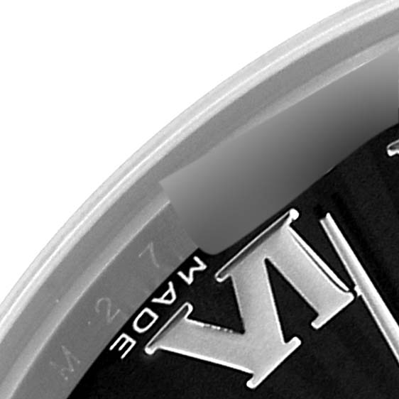 This image shows part of the dial and bezel of a Rolex Mid-Size 178240 Women's Stainless Steel Black Dial 178240 Women's Stainless Steel Black Dial watch, focusing on the Roman numeral VI and surrounding details.