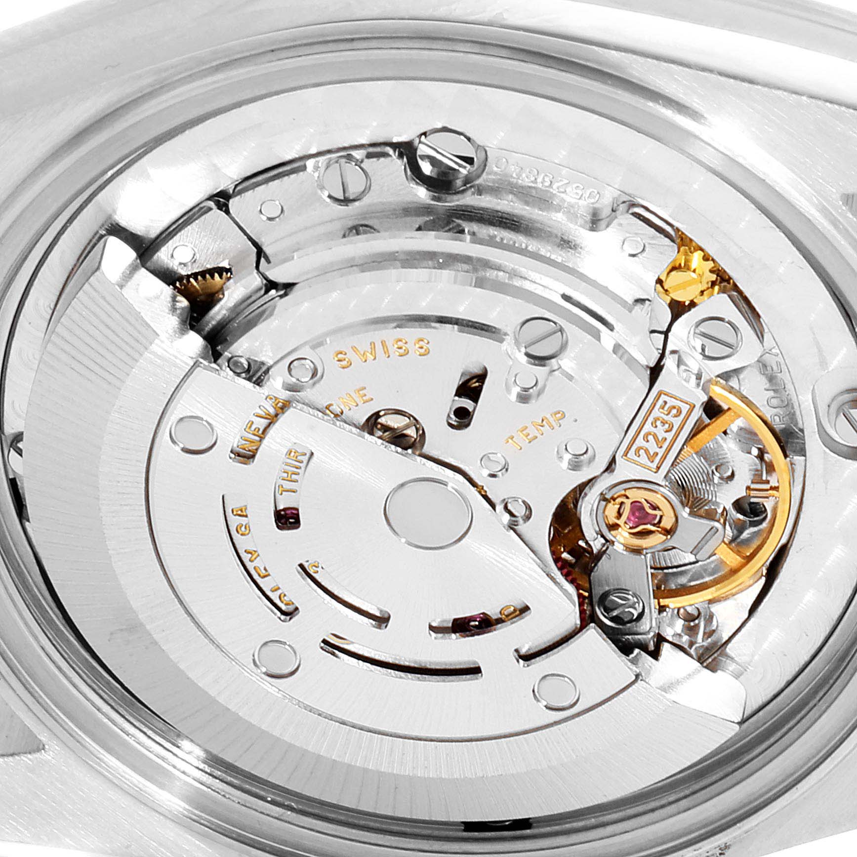 The image shows the internal mechanism of a Mid-Size Rolex watch, specifically highlighting the movement parts.