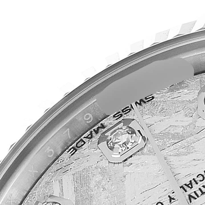 The image shows a close-up angle of the dial and bezel of a mid-size Rolex watch.