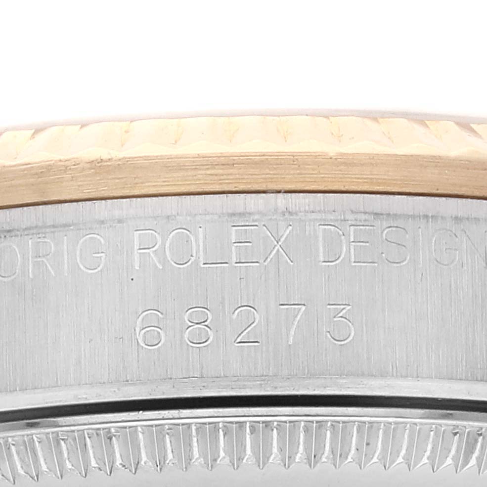 The image shows a close-up of the side of a mid-size Rolex watch, highlighting the engraved model number 68273 and design.