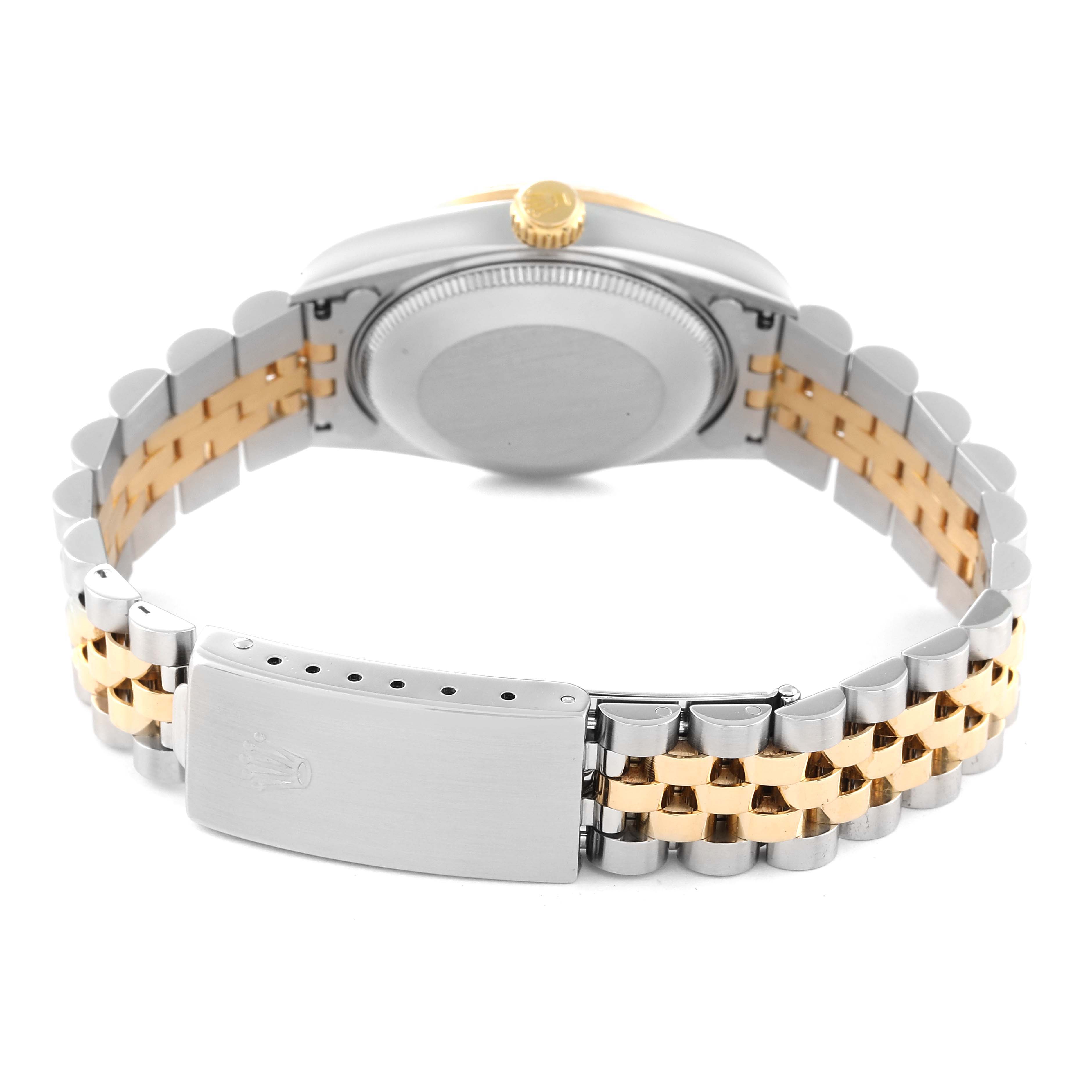 The image shows the back view of a Rolex Mid-Size 68273 Women
s Steel and Gold (two tone) Champagne Dial 68273 Women
s Steel and Gold (two tone) Champagne Dial watch, displaying its caseback, crown, and two-tone bracelet with the clasp.