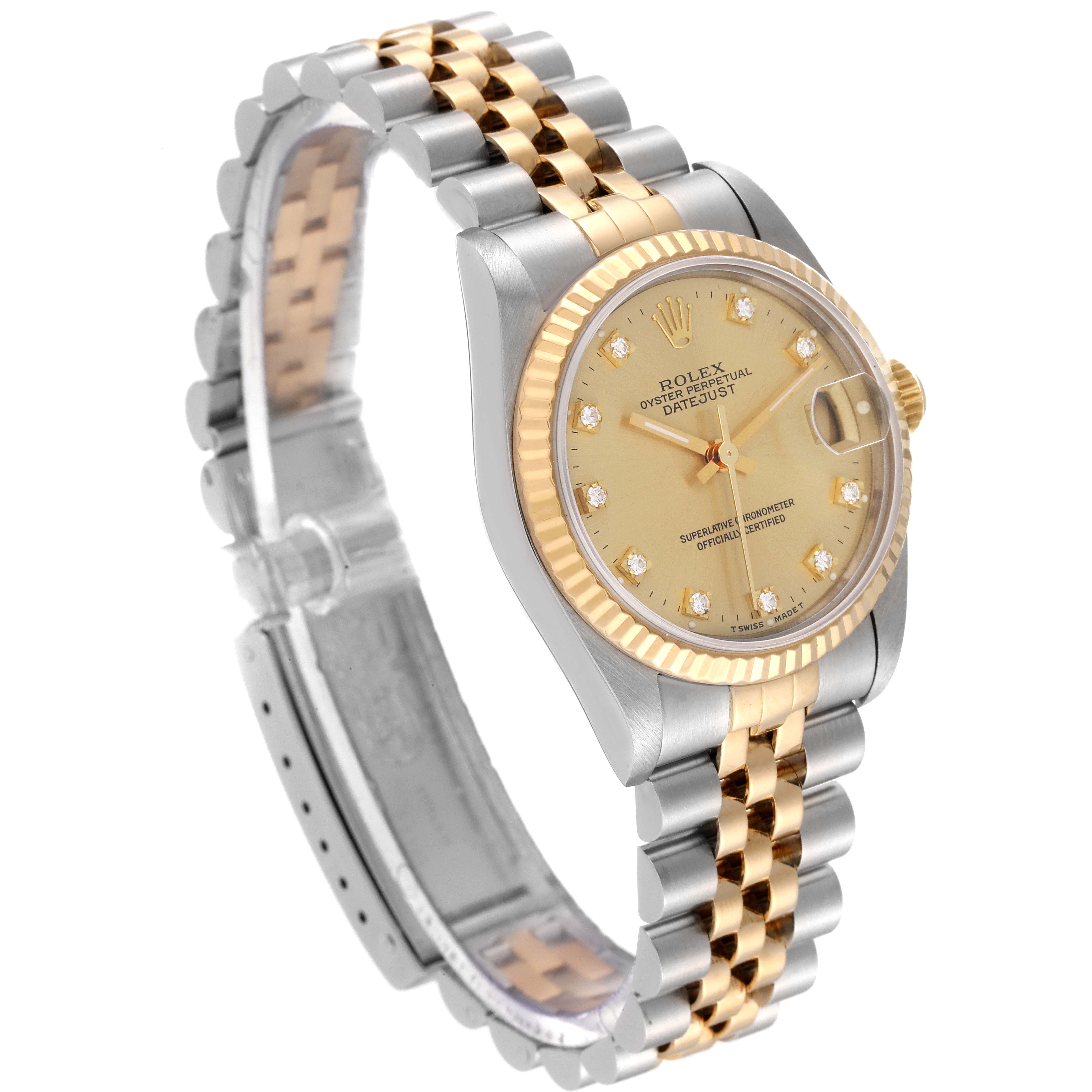 This image shows a Rolex Mid-Size 68273 Women
s Steel and Gold (two tone) Champagne Dial 68273 Women
s Steel and Gold (two tone) Champagne Dial Datejust watch at a three-quarter angle, displaying its two-tone bracelet, bezel, and face.