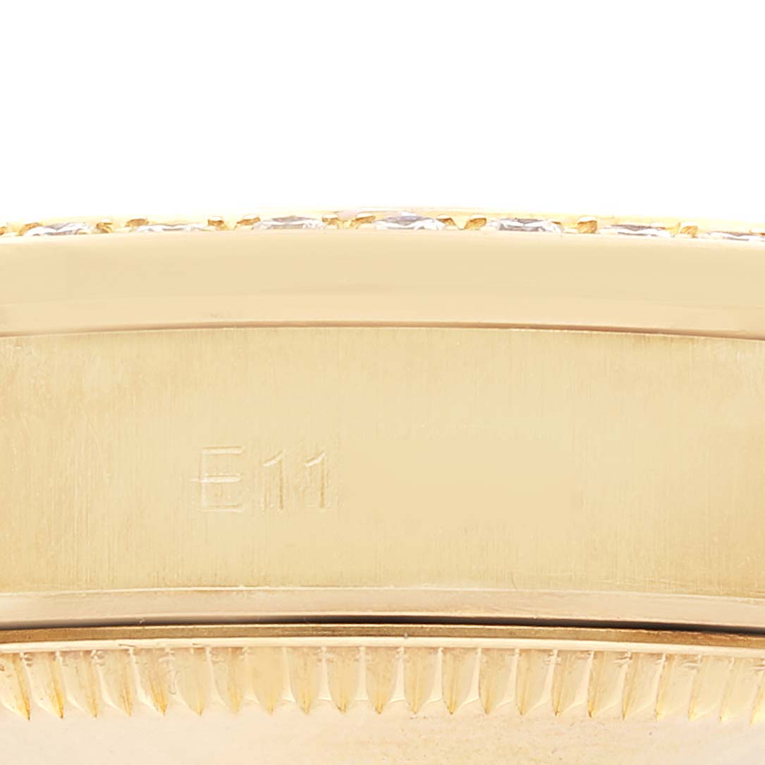 This is a close-up view of the case side and bezel of the Rolex President 68158 Women
s Yellow Gold Champagne Dial 68158 Women
s Yellow Gold Champagne Dial model watch, showing the "E11" engraving.