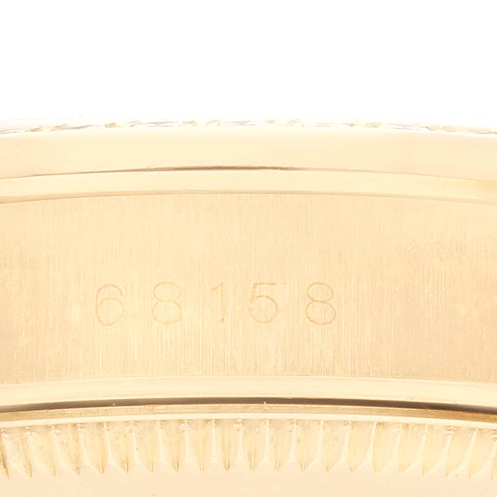 The image shows the serial number engraving on the case side of a Rolex President 68158 Women
s Yellow Gold Champagne Dial 68158 Women
s Yellow Gold Champagne Dial model watch.