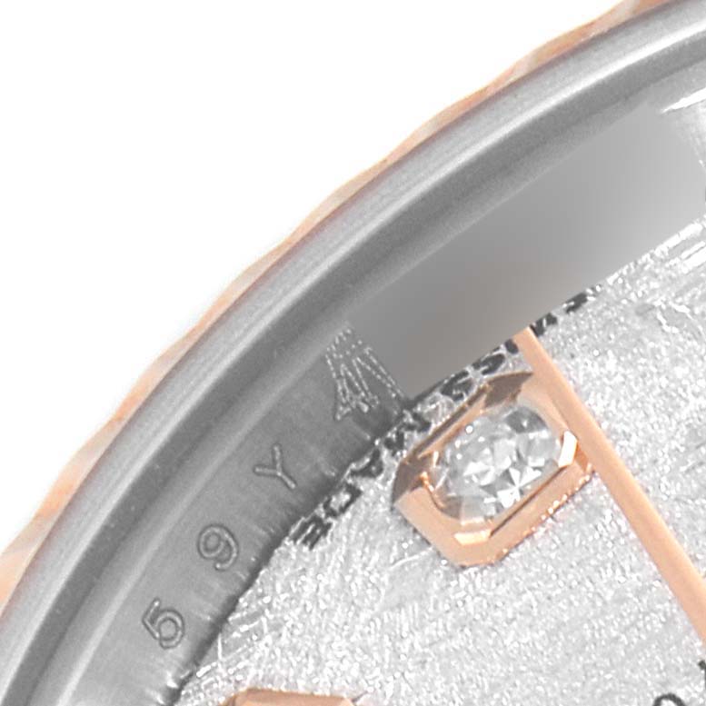 This image shows a close-up of the dial edge and a diamond hour marker on the Rolex Datejust 179171 Women's Steel and Gold (two tone) Silver Dial 179171 Women's Steel and Gold (two tone) Silver Dial watch.
