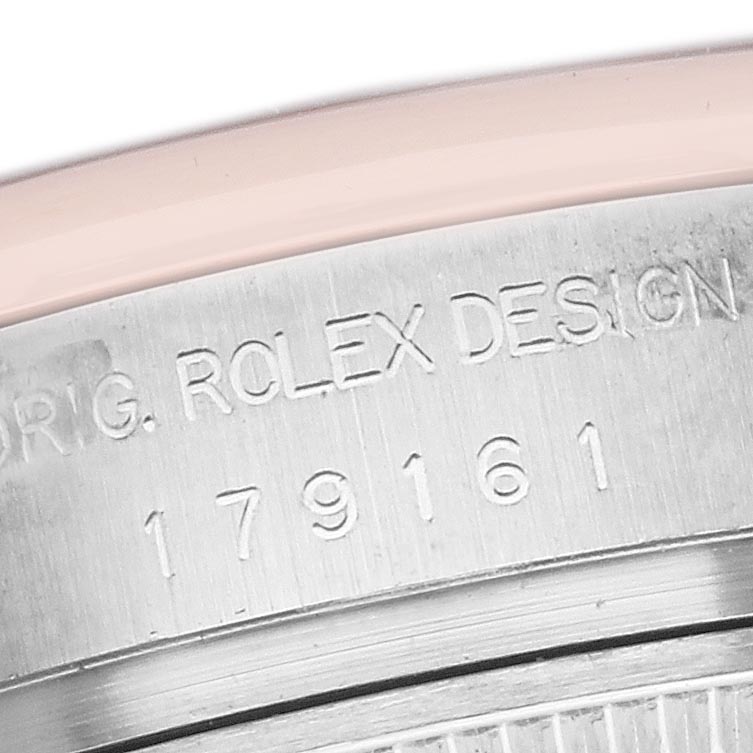 The image shows a close-up of the case back with engraving details of the Rolex Datejust 179161 Women's Steel and Gold (two tone) Black Dial 179161 Women's Steel and Gold (two tone) Black Dial model.