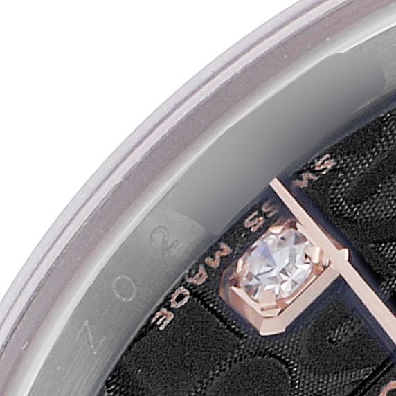 The image shows a close-up of the dial edge and a diamond marker on a Rolex Datejust 179161 Women's Steel and Gold (two tone) Black Dial 179161 Women's Steel and Gold (two tone) Black Dial watch, viewed from an angled side perspective.