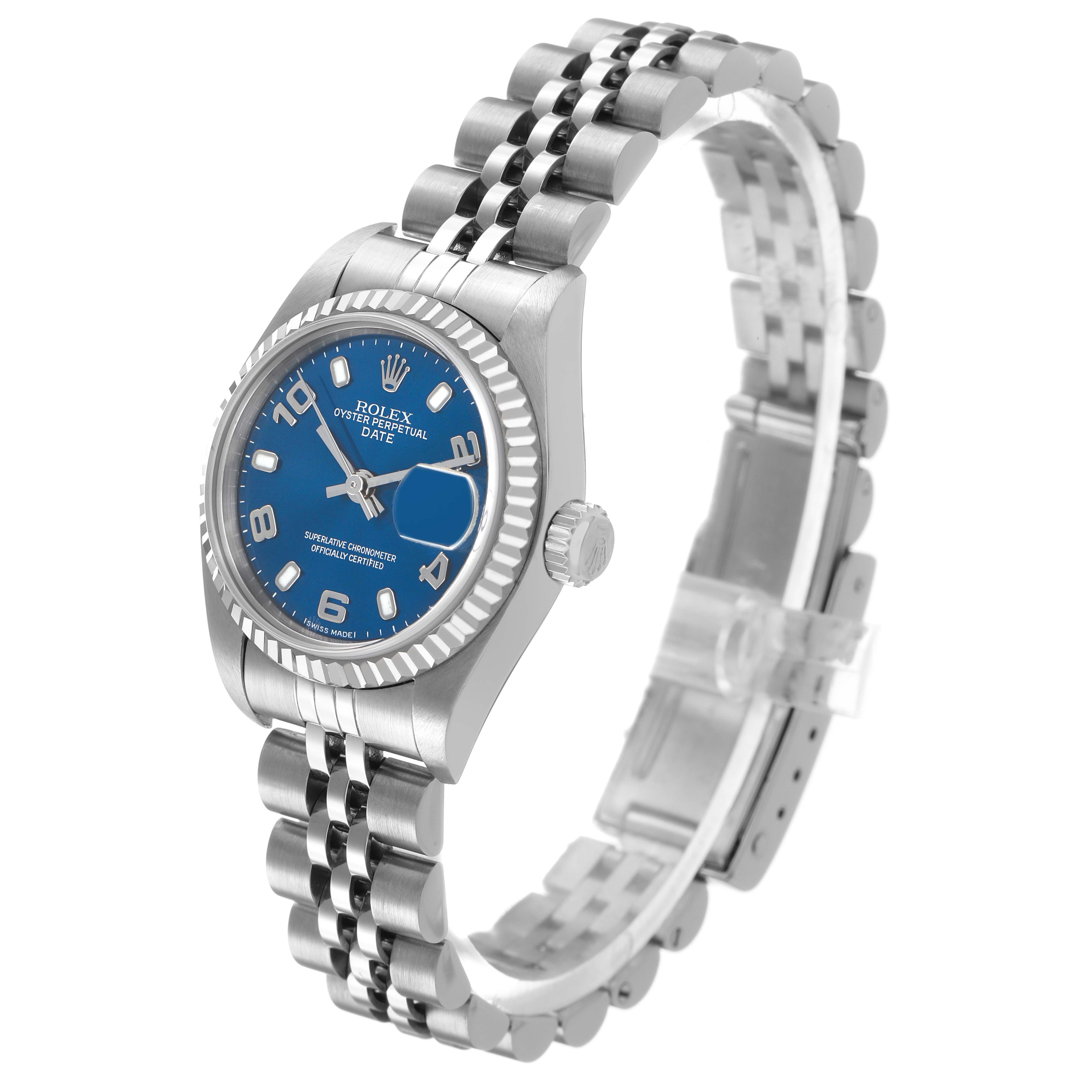 The Rolex Datejust 79174 Women's Stainless Steel Blue Dial is shown at a side angle, highlighting the blue dial, fluted bezel, crown, and jubilee bracelet.