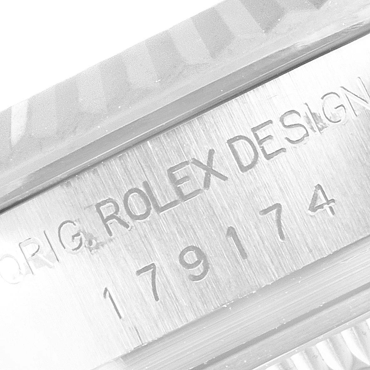 The close-up image shows the side engraving and fluted bezel of a Rolex Datejust 179174 Women
s Stainless Steel Mother of Pearl Dial 179174 Women
s Stainless Steel Mother of Pearl Dial watch.