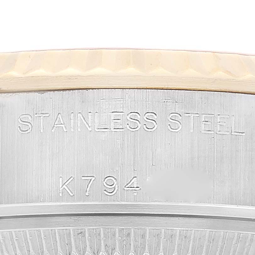 The image shows the side engraving on the stainless steel case of the Rolex Datejust 79173 Women's Steel and Gold (two tone) Champagne Dial 79173 Women's Steel and Gold (two tone) Champagne Dial watch.